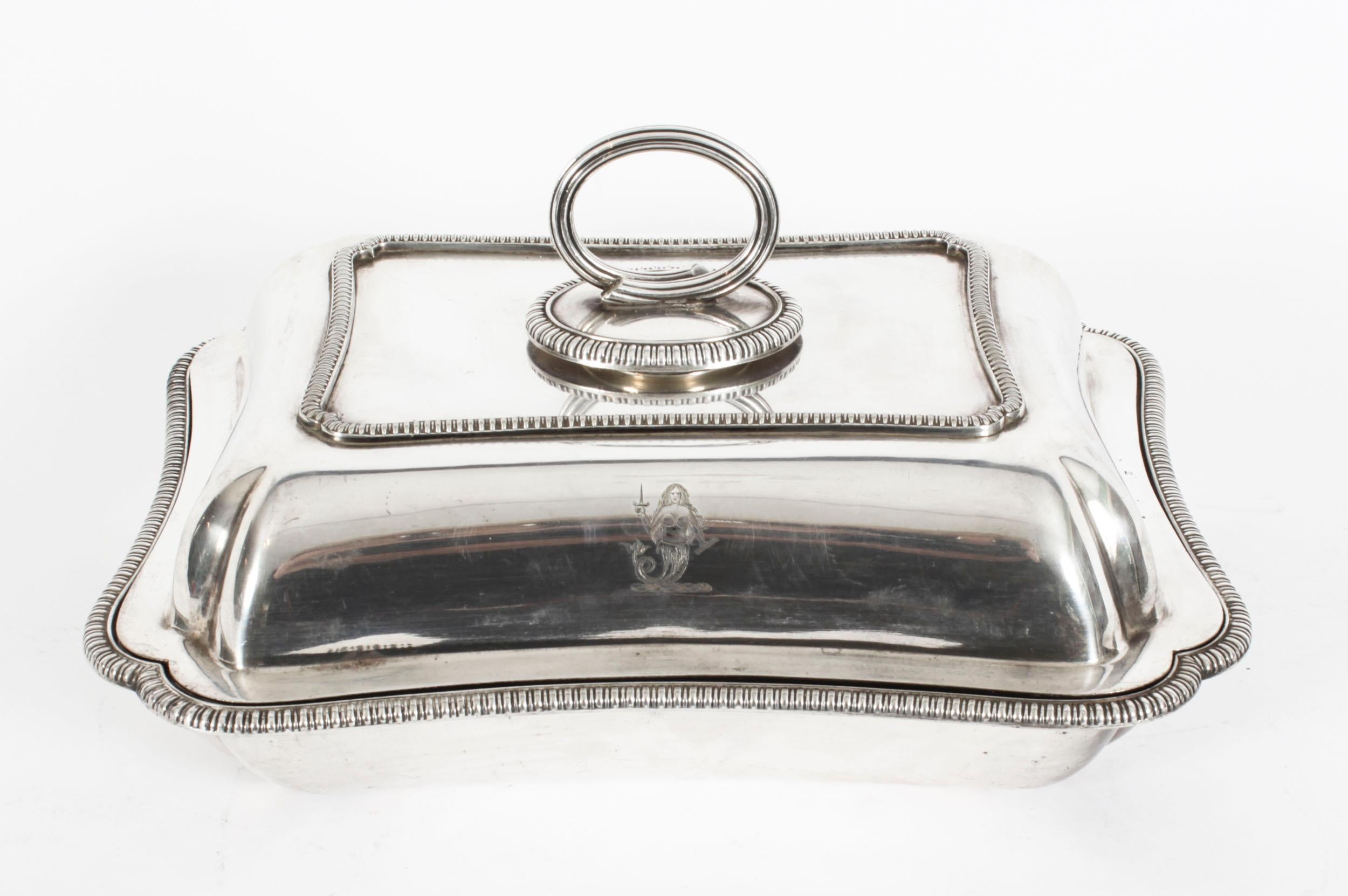 This is an exquisite and rare antique pair of English silver plated Entree dishes by the renowned silversmith Elkington & Co, and dated 1888.
 
The dishes feature a rectangular shape with delightful matching gadrooned rims to the lid and dish,