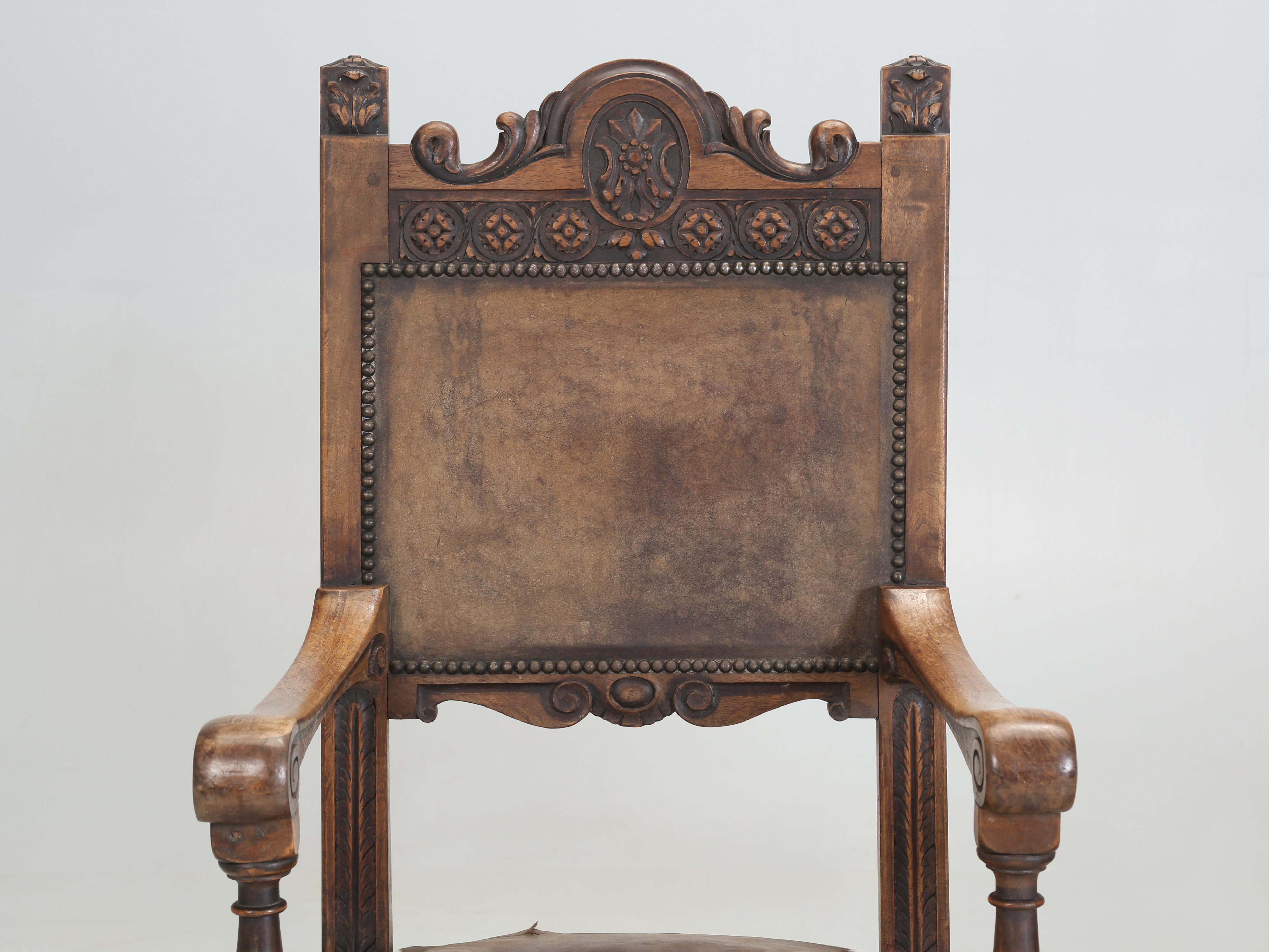 Antique Pair of Spanish Arm Chairs that are completely unrestored and still retain their original leather upholstery. Although the leather looks beyond repair, we can tell you from personal past experience that the original leather can be saved, if