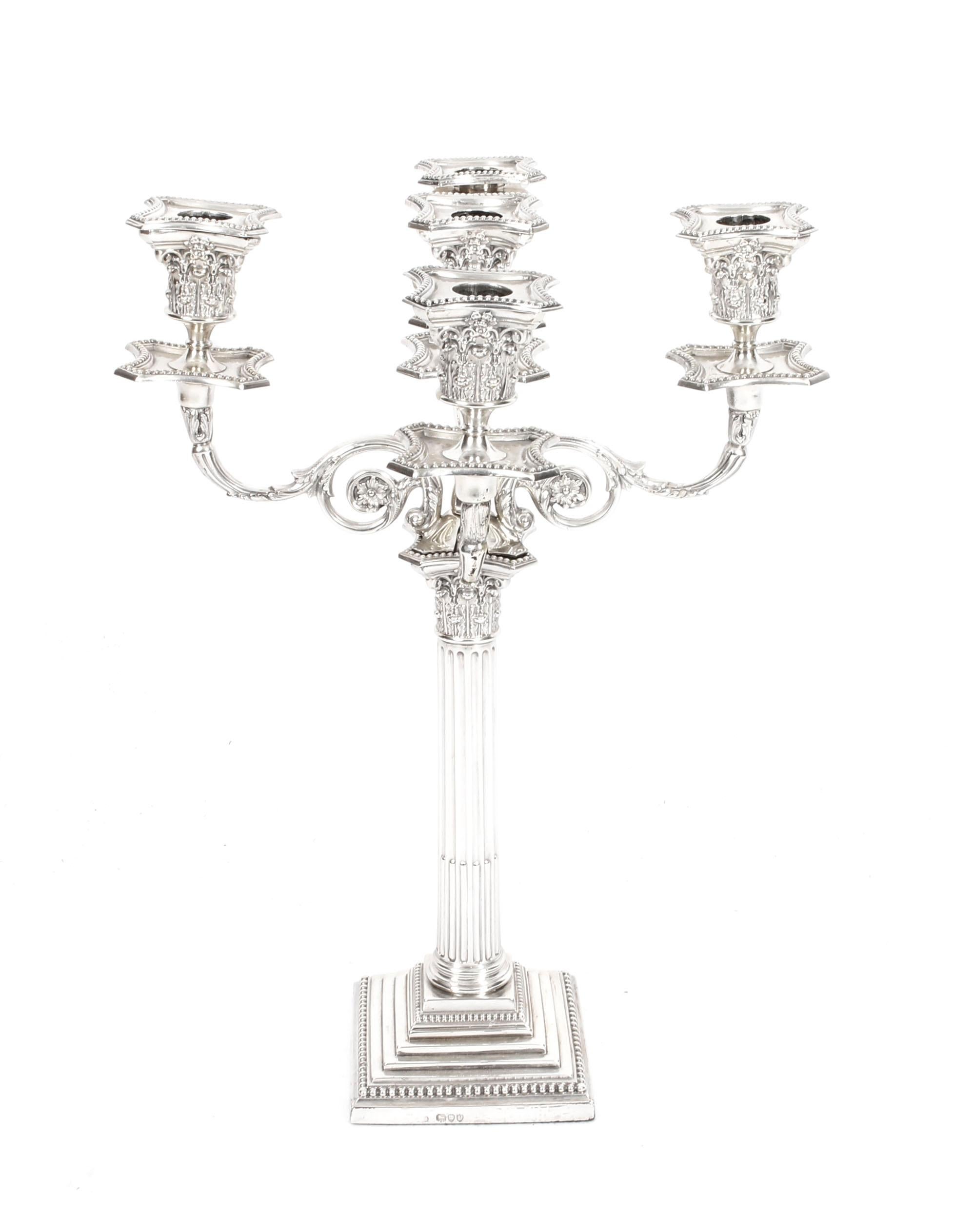 This is a magnificent high-quality pair of antique English Victorian sterling silver five-light candelabra, each bearing the maker's mark of the renowned silversmith, Charles Boyton, and hallmarks for London 1890.

Each candelabra feature an