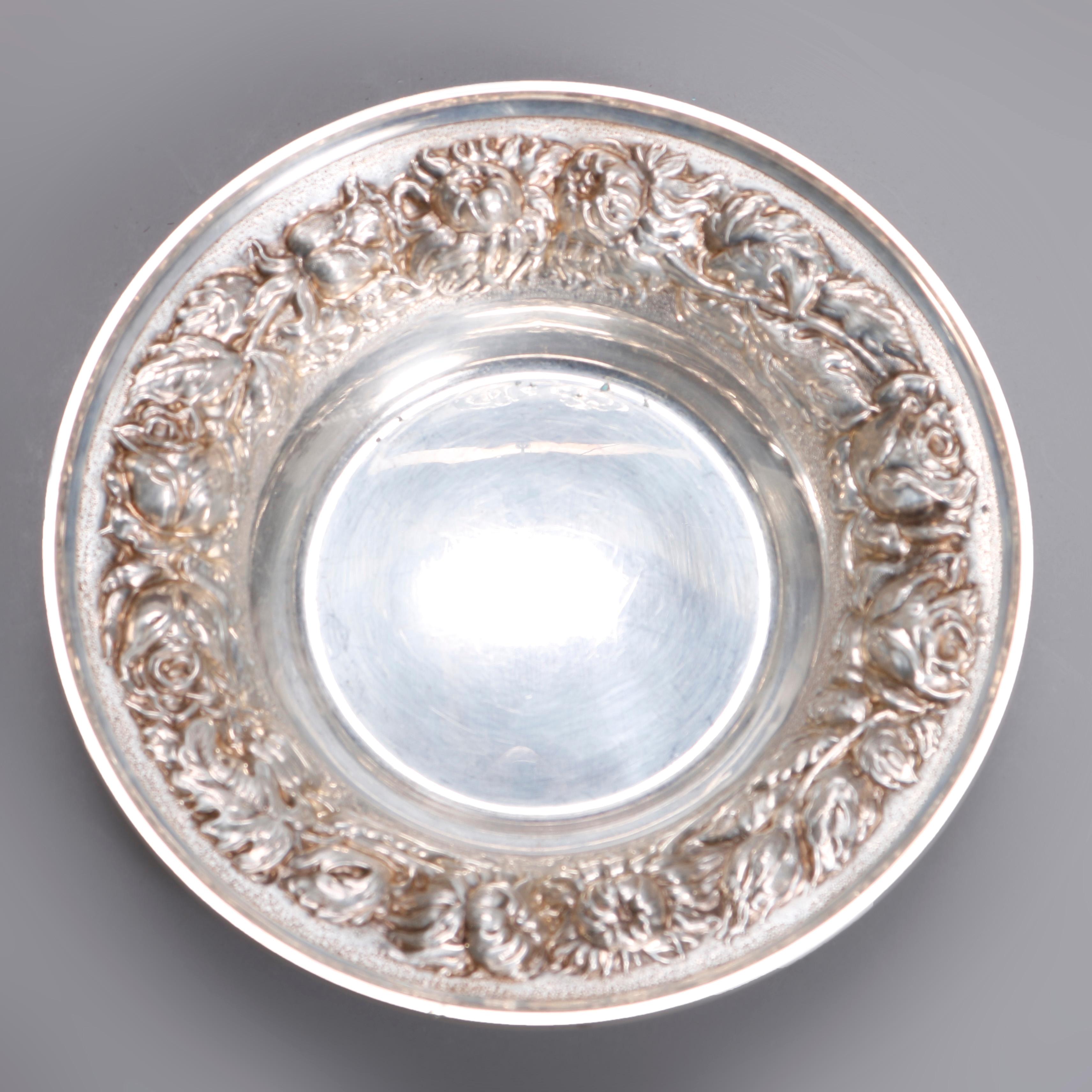 An antique pair of sterling silver nut or candy bowls by Kirk & Stieff offer foliate and fruit repousse decoration, one with ball feet, 6.7 toz total, circa 1900
Repousse bowls, circa 1900 6.7 toz
Candy dishes
Measures: 1.5
