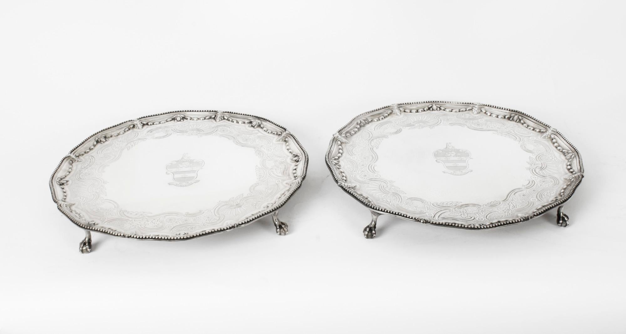 This is a wonderful pair of English 18th Century antique sterling silver salvers by the renowned silversmith John Carter.
 
They each have hallmarks for London 1772, the makers mark of John Carter and are typical of his work with the exquisitely