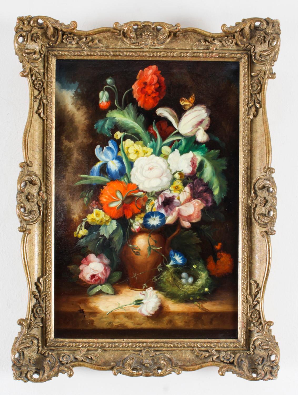 This is a magnificent pair antique oil on canvas European School still-life paintings with stunning gilt and gesso frames and dating from the late 19th century.
 
This splendid pair feature beautiful bouquets of flowers in vases on a stone
