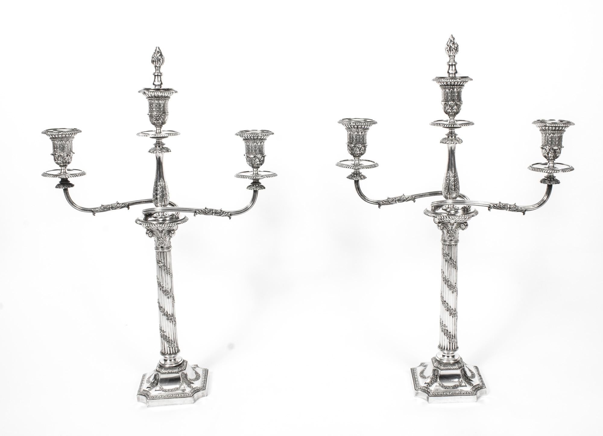 This is a fabulous pair of antique Victorian silver plated, three light, two-branch table Corinthian column candelabra, circa 1880 in date, and bearing the makers mark of the renowned silversmiths Horace Woodward & Co. of Birmingham England.
 
The