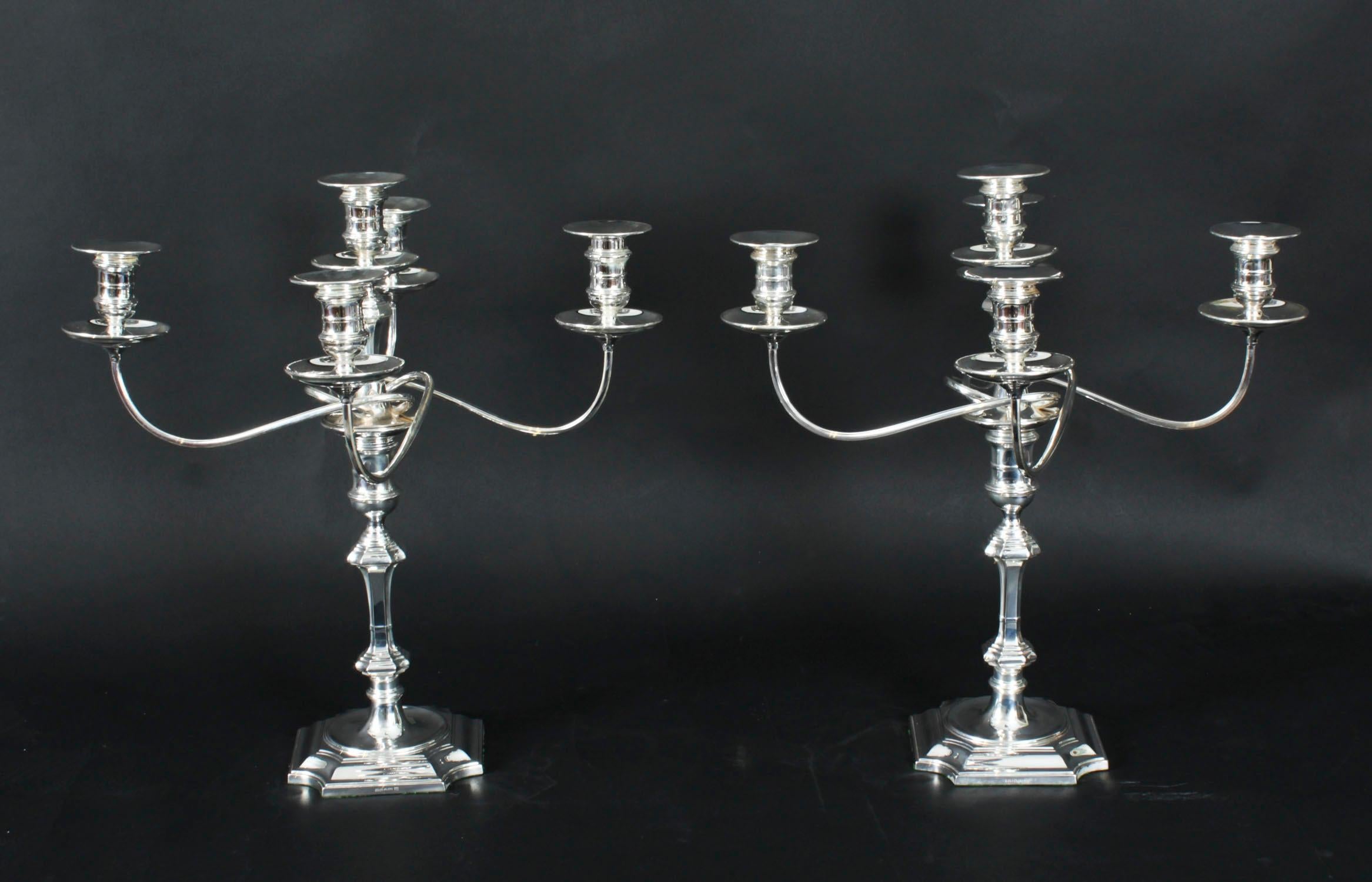 This is a stunning pair of English antique Queen Anne design Victorian silver plated, five light, four-branch table candelabra, circa 1890 in date, and each bearing the makers mark of the renowned English silversmiths Hawksworth Eyre & Co.

The