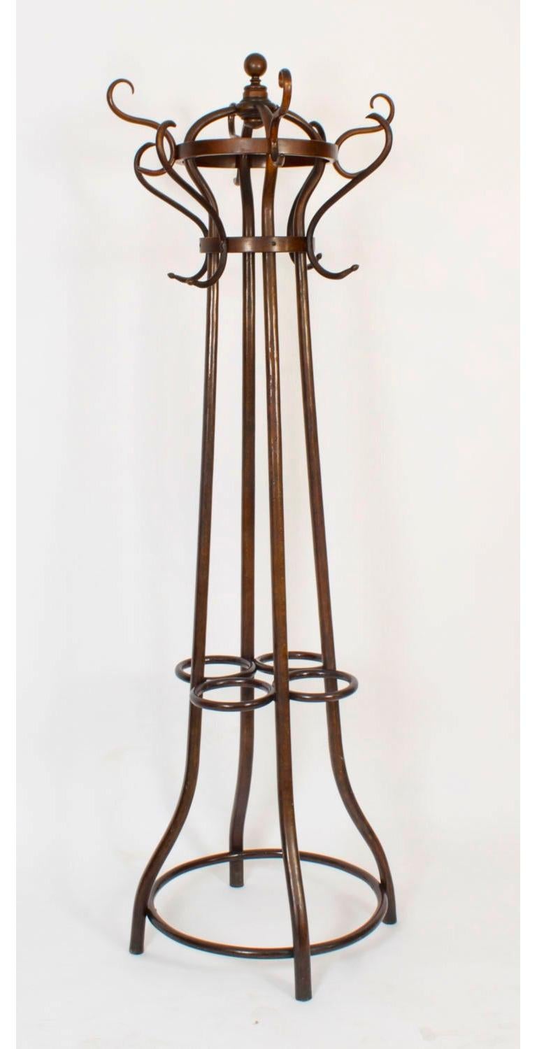 An excellent and rare antique pair of Thonet Vienna Art Nouvean free standing ormolu mounted bentwood coat / hat / stick stands, late 19th century in date.

The pair of stained beech bentwood hall stands feaure eight S-scroll form hat and coat pegs