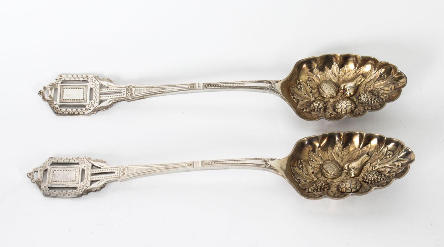 This is a lovely antique Victorian cased silver plated pair of Berry serving spoons C 1860 in date.
 
The spoons have cast stylised handles with gilt hand-chased bowls decorated with fruit, housed in their original black leather case with fitted