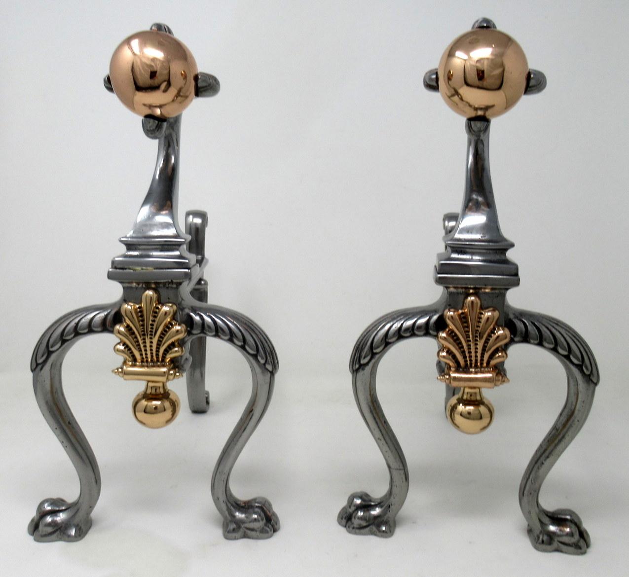 A stylish example of an early Victorian Country House style identical pair of heavy duty burnished steel and polished copper fire dogs, chenets or andirons of unusually large proportions, mid-19th century, possibly earlier of English or French