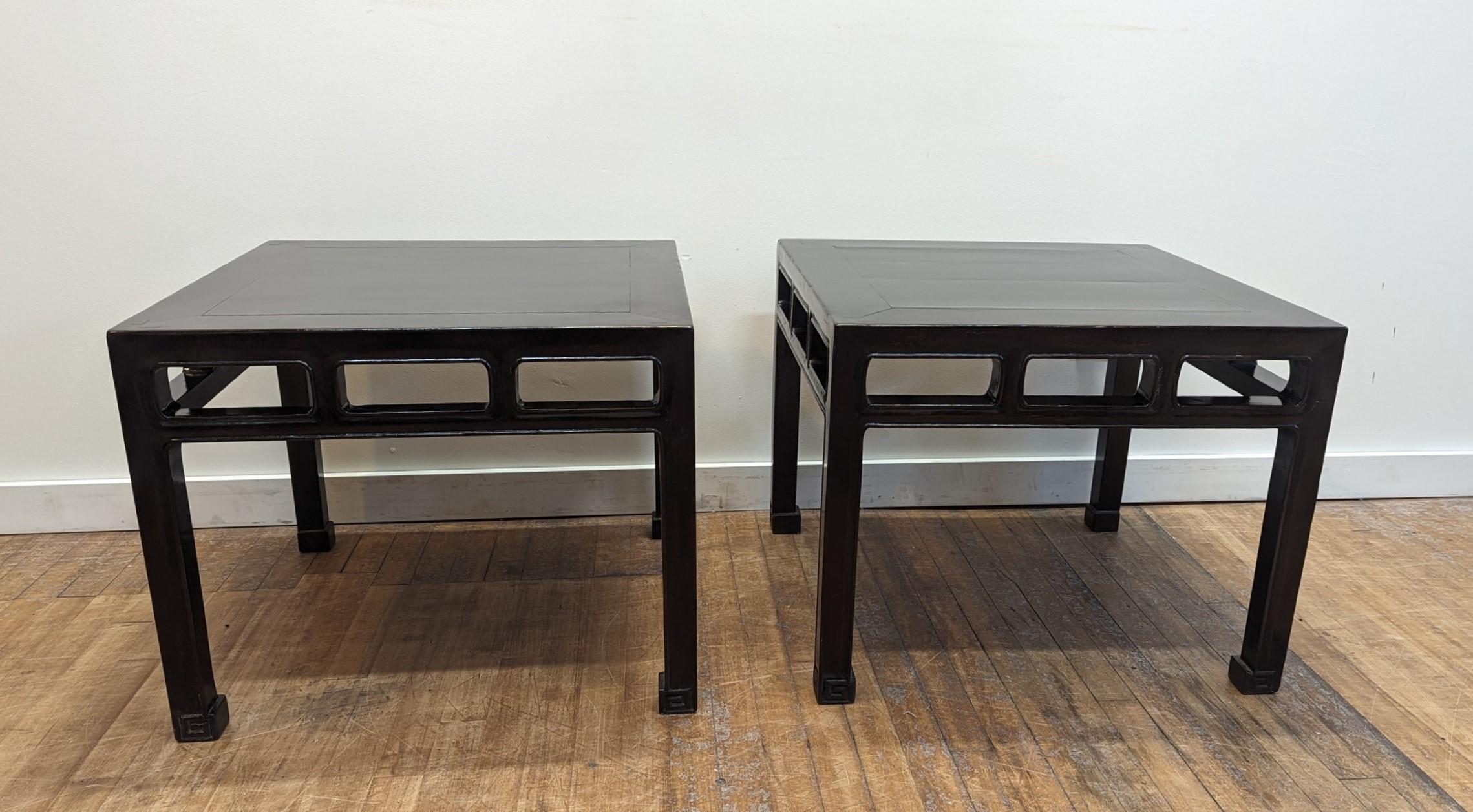 Pair of Antique Chinese Side Tables.  An exquisite pair of Elm wood Qing Dynasty Side Tables.  Floating panel tops sent in a flush frame with 