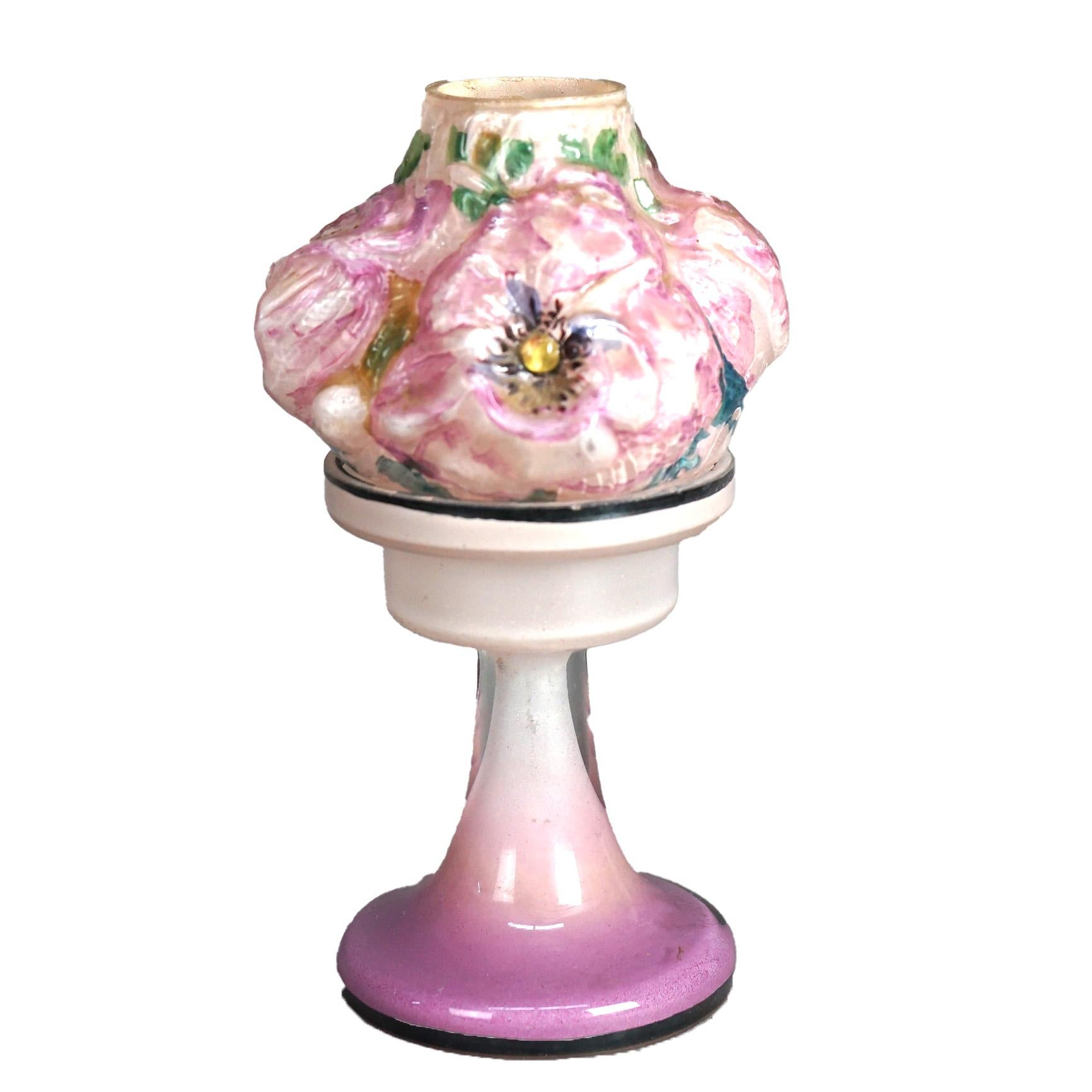 An antique candle lamp by Pairpoint offers art glass construction with blown shade having floral design with peonies, seated on pedestal base, c1910

Measures - 8