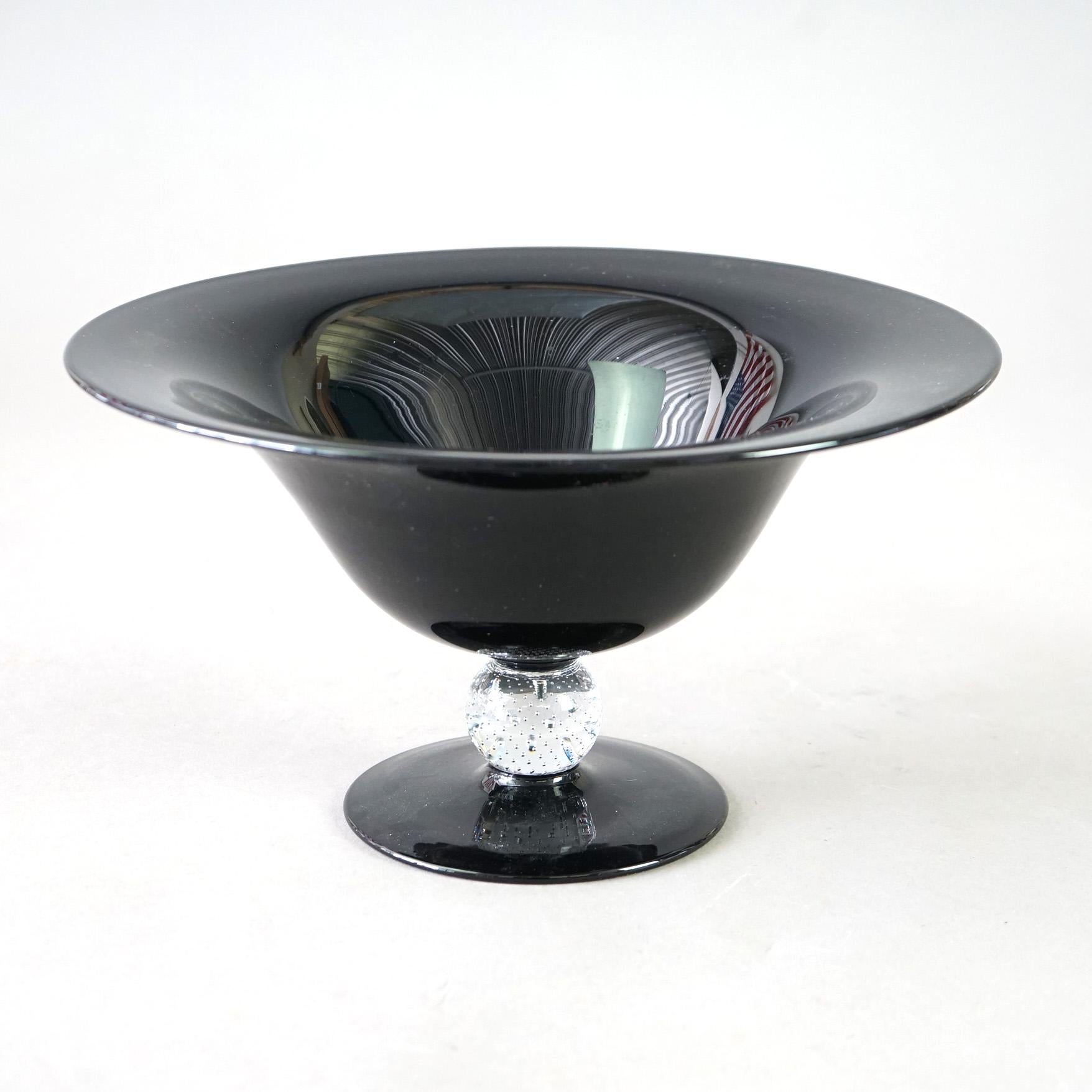 An antique compote in the manner of Pairpoint offers black amethyst art glass construction in flared form with colorless controlled bubble glass ball column, c1920

Measures - 6.75