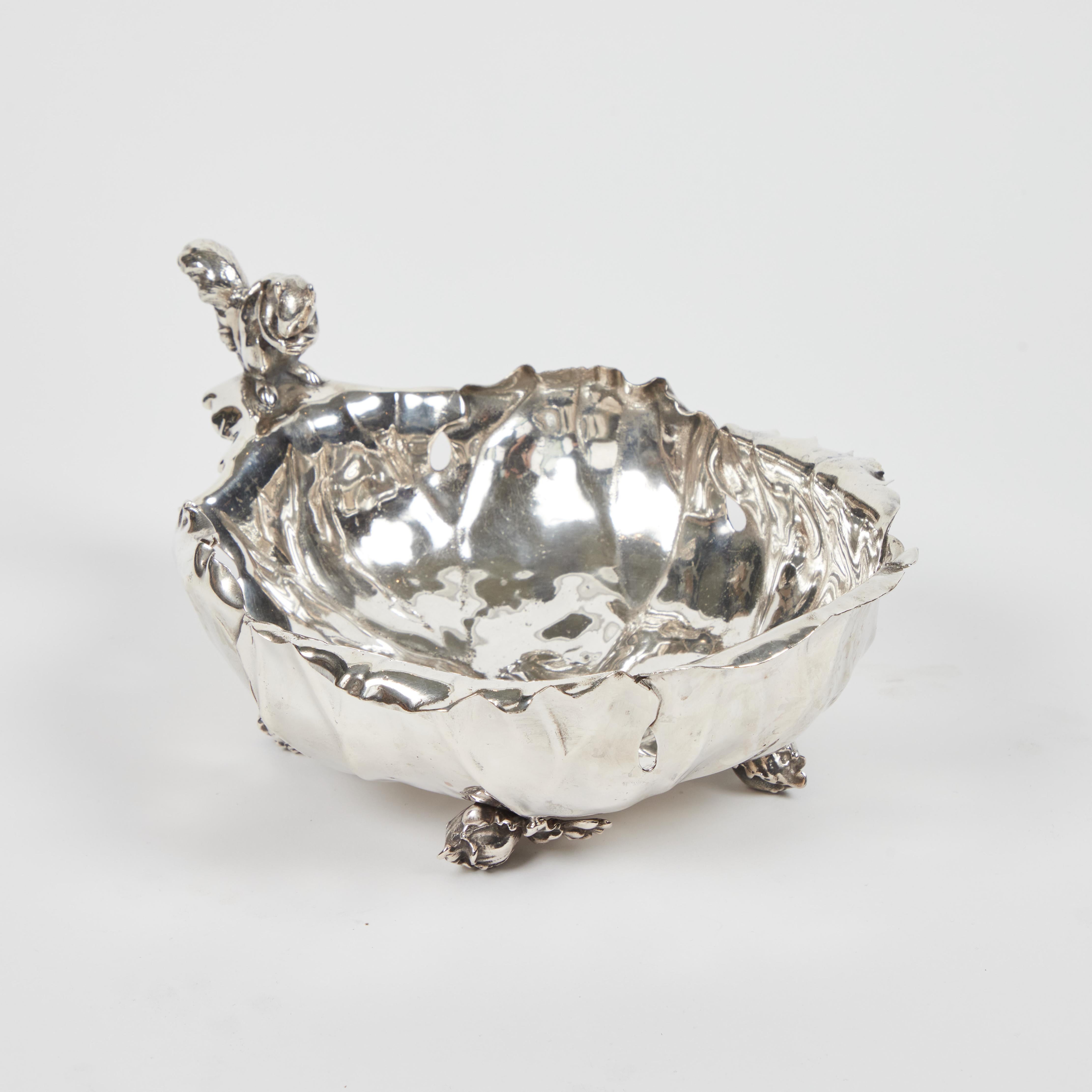 Made by the Pairpoint Manufacturing Co. Circa 1880-1900. This figural leaf form dish has a detailed figure of a squirrel holding a nut as a handle with a branch form support, it rests on four figural leaf bud feet. It is stamped at the bottom,