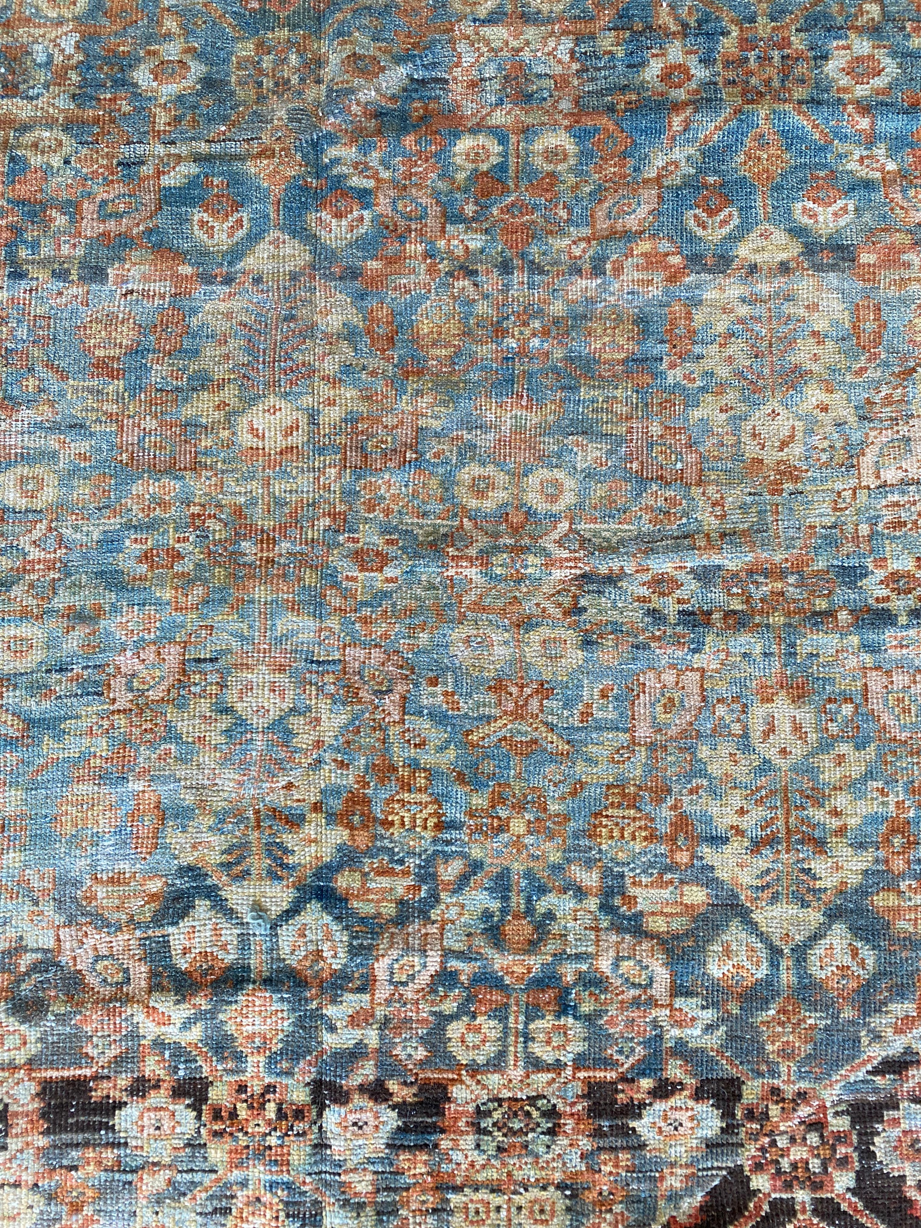 Palace size grand antique Persian Mahal, circa 1900. A highly sought after all over herati pattern in a rich array of colors. This rug has been expertly altered from its original design that featured a large central medallion. The medallion was