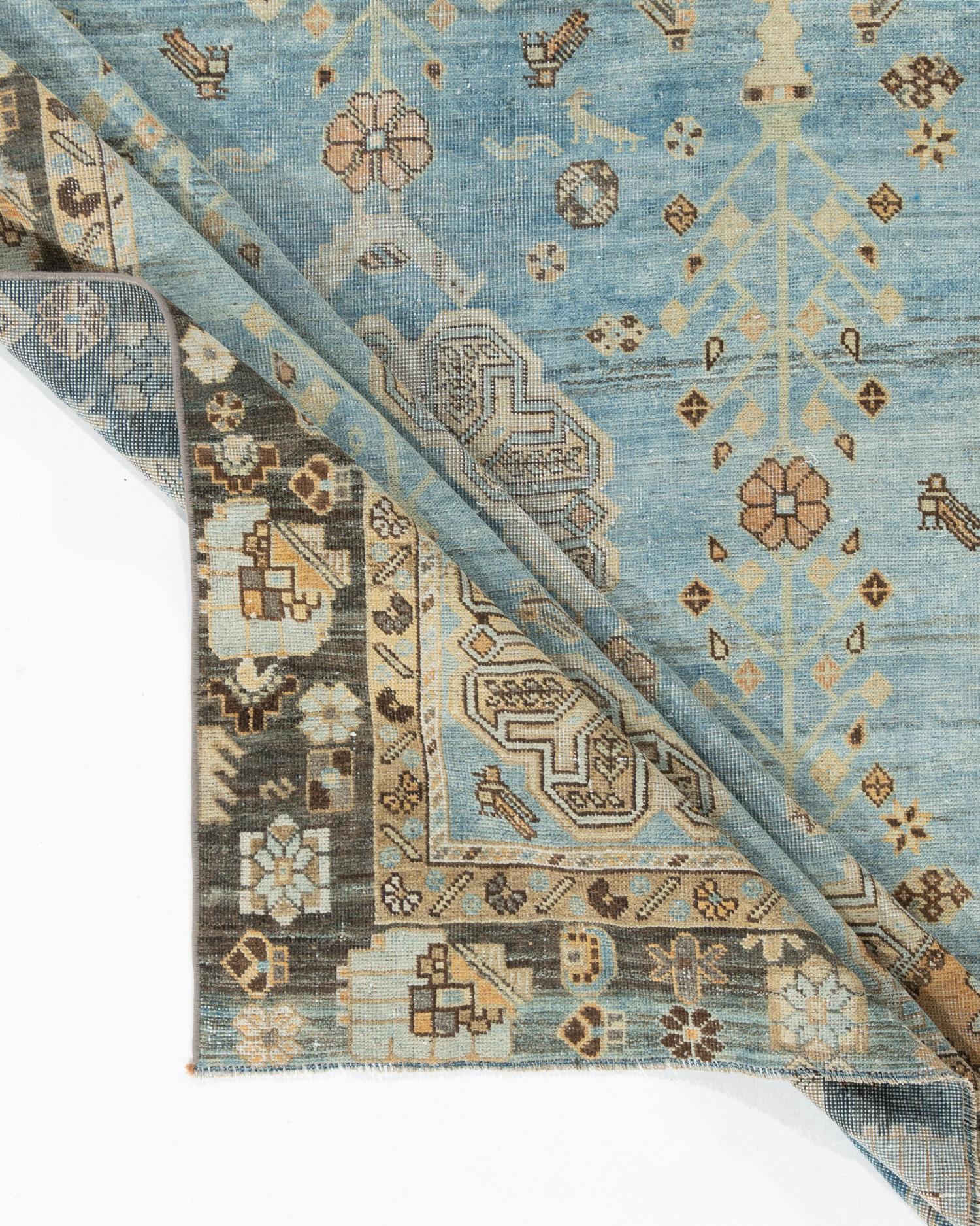 Vintage pale blue Turkish Sivas area rug, measures: 4'8 X 6'. Sivas in eastern Anatolia is best known for interpretations in light tones of Persian, especially Tabriz, designs. They are decorative in the best sense but are actually quite hard to