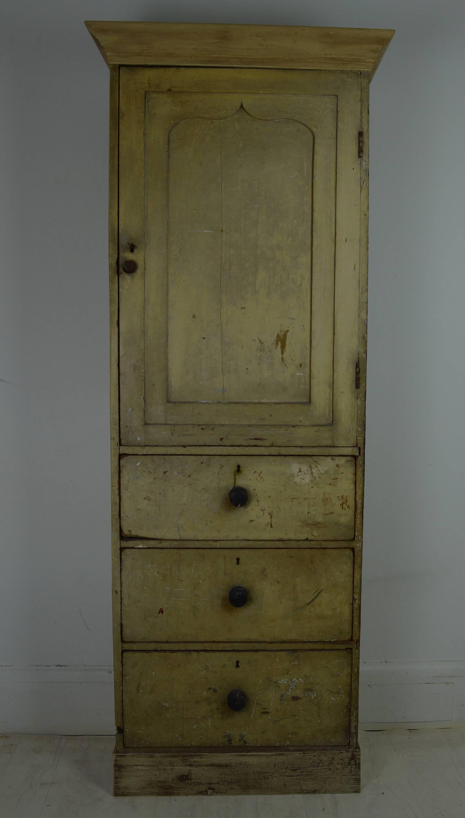 Wonderful slim painted housekeepers cupboard in a great pale yellow or ivory color.

Equally beautiful interior in an aquamarine or blue color.

The paint is mostly original.

The cornice and plinth are later additions made from old material.
