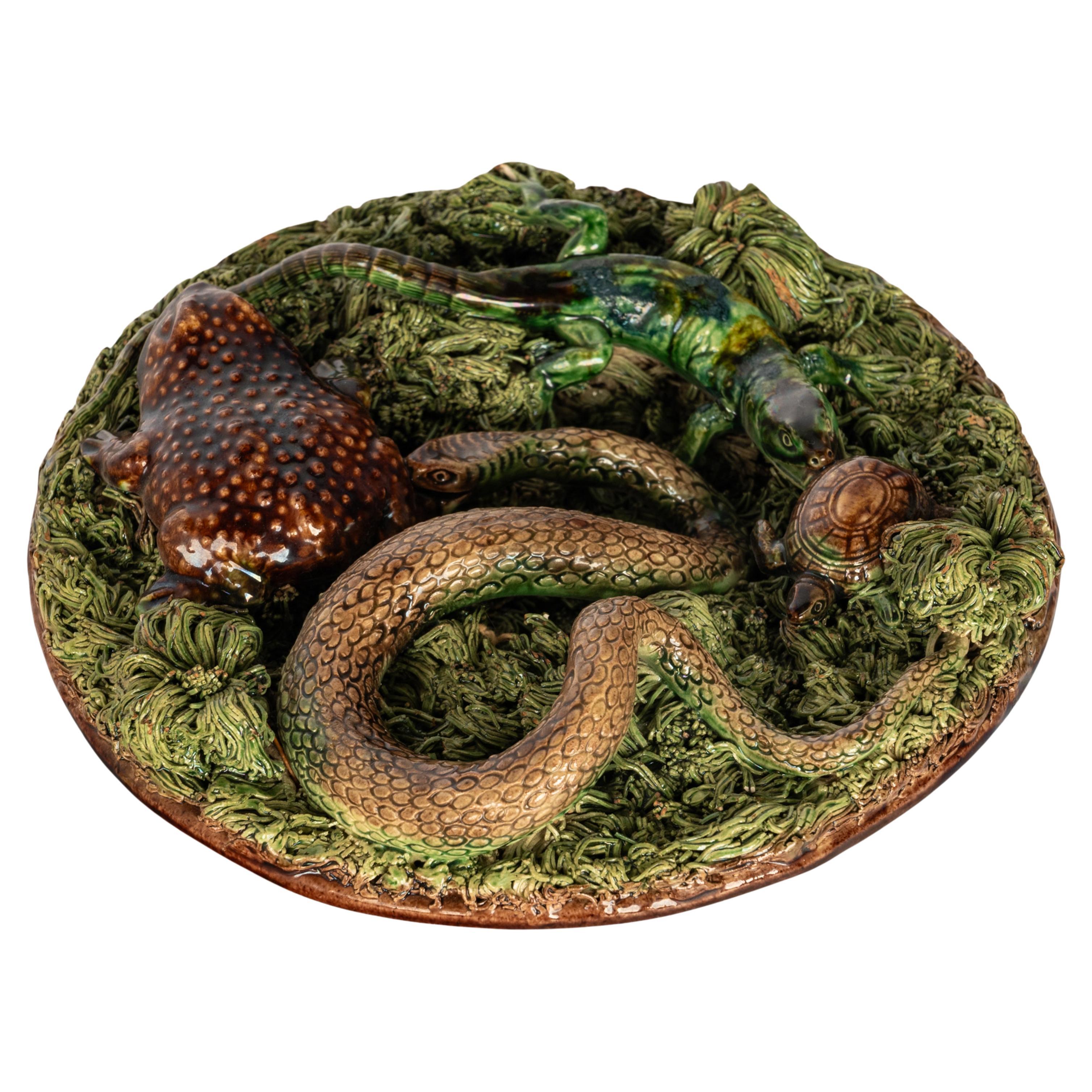 A fabulous large antique Palissy Ware 'grotesque' pottery majolica plate, made by Manuel Mafra (1830-1905), Portugal, Circa 1880.
The plate made in the last quarter of the 1800s by the pioneer of Palissy ware style pottery in Portugal, Manuel Mafra