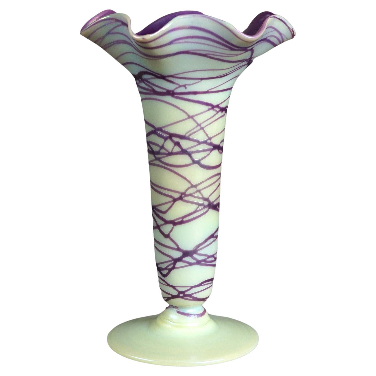 An antique Palmer - Koenig Bohemian vase offers art glass construction in fluted form with eggplant threading and interior as well as ruffled rim, signed on base as photographed, shape #218, c1920

Measures - 9