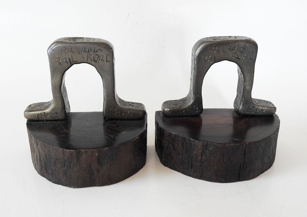 Pair of antique Panama Railroad iron tracks bookends.  This track was in use from 1853 - 1869, info is stamped onto iron, nice dark slab wood bases, Pair of antique Panama Railroad iron tracks bookends.  This track was in use from 1853 - 1869, info
