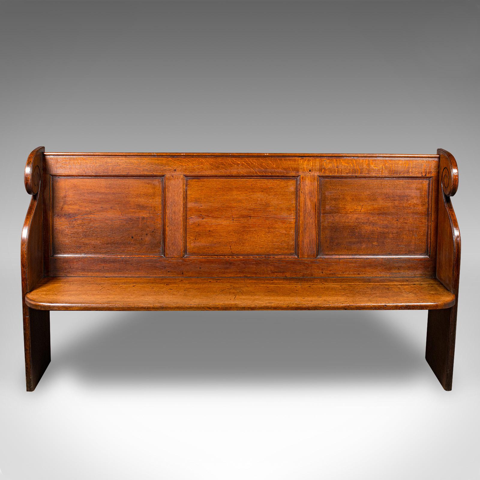 
This is an antique 3 panelled church pew. An English, oak bench with ecclesiastic taste, dating to the early Victorian period, circa 1850.

Superb in proportion and finish, with distinctive serpentine curvature
Displays a desirable aged patina and