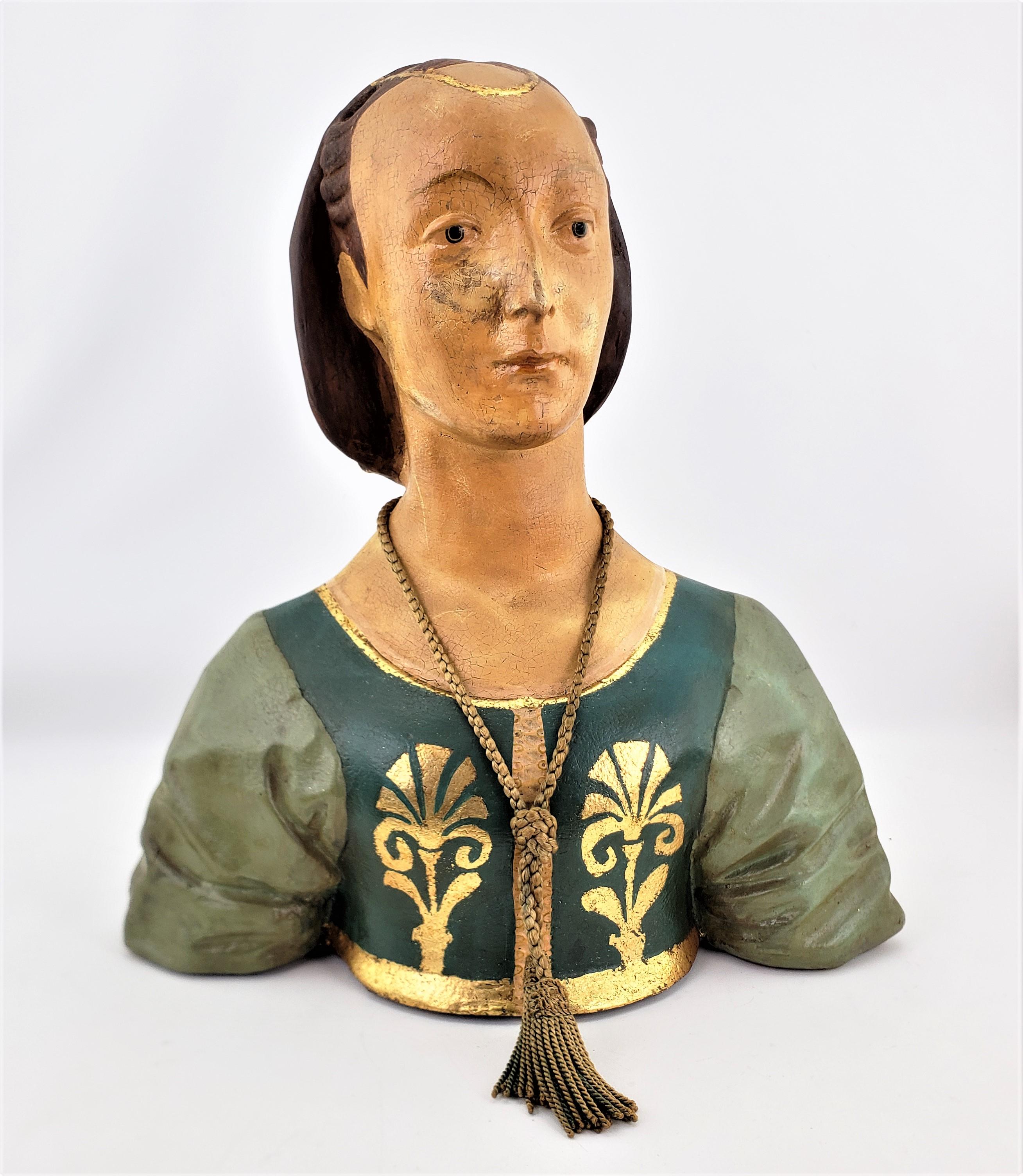 This antique paper mache female bust is unsigned, but presumed to have originated from England and dating to the 1920's and done in a Victorian style. The sculpture is done completely in paper mache which has been hand-painted in a realistic manner,