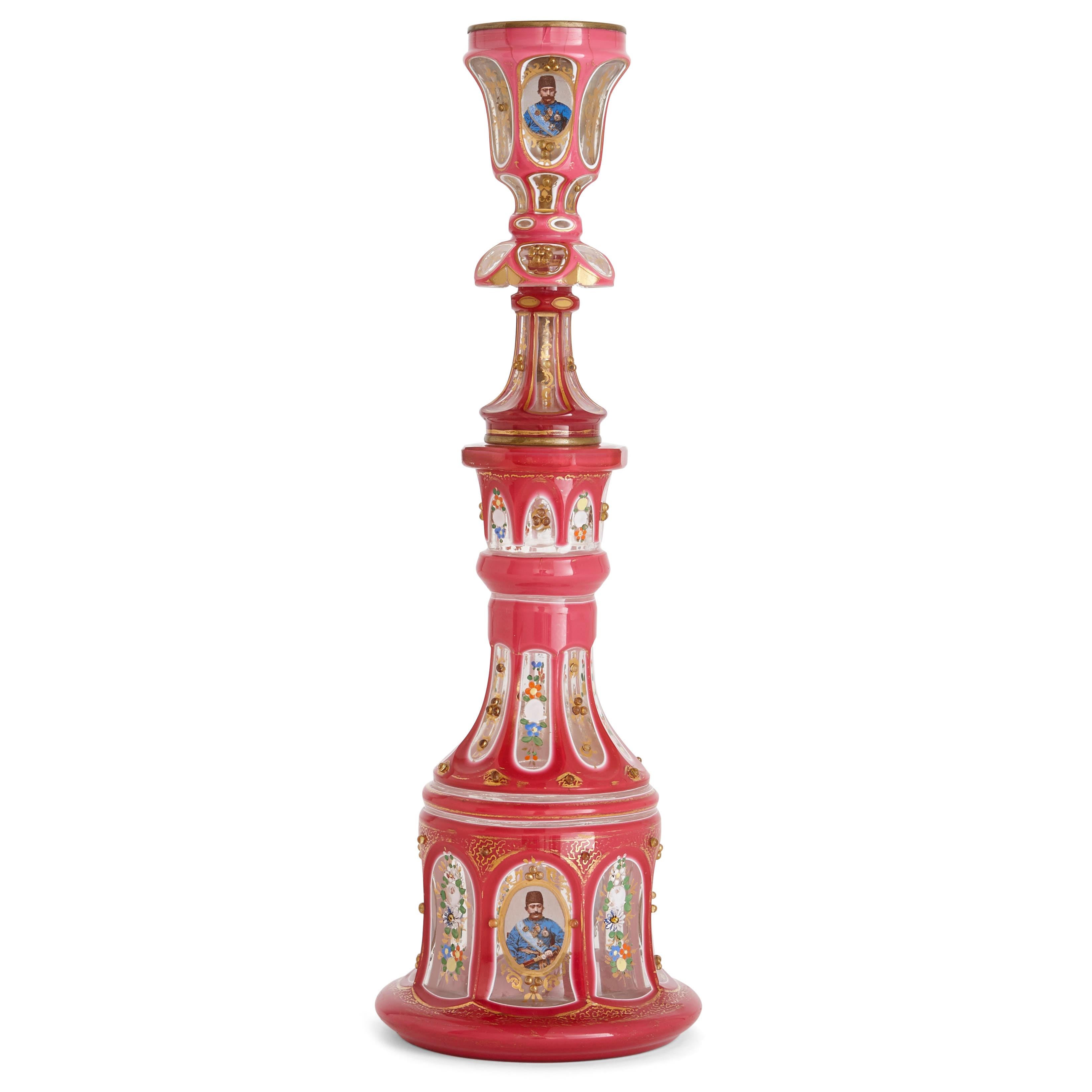This huqqa (or hookah) is a superb example of the beauty and high quality craftsmanship of Bohemian glassware. The huqqa is decorated with photo-realistic portraits of the Qajar kings, Naser al-Din Shah (reigned 1848-1896) and Mozaffar al-Din Shah