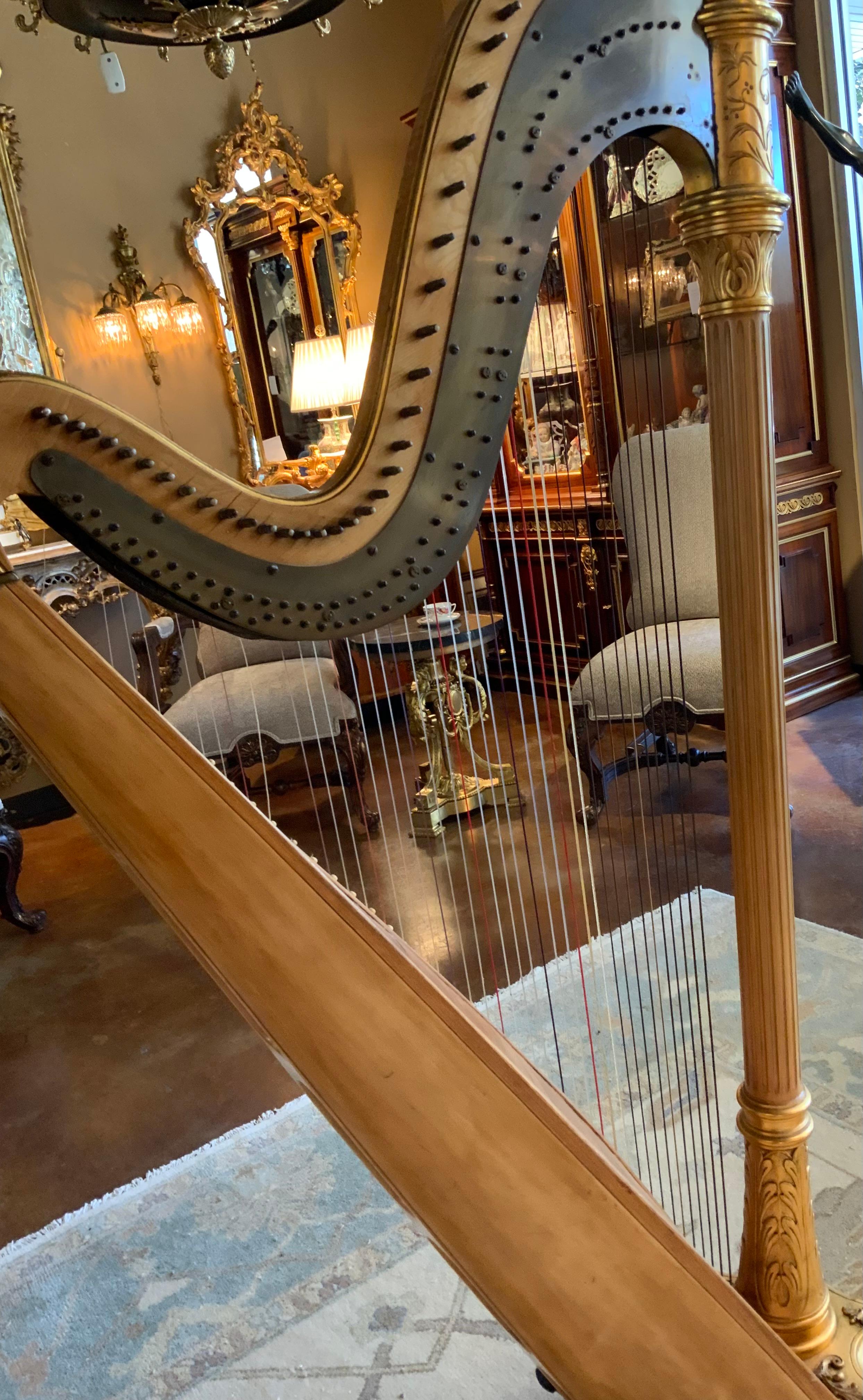 The sculptured case is in exceptional condition with
Beautiful gilding. It has seven pedals and the inscription 
On the case indicates it was made by a Chicago firm by
The name of Lyon and Healy. 