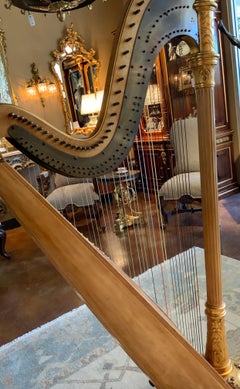 Antique parcel gilt musical harp by Lyon and Healy