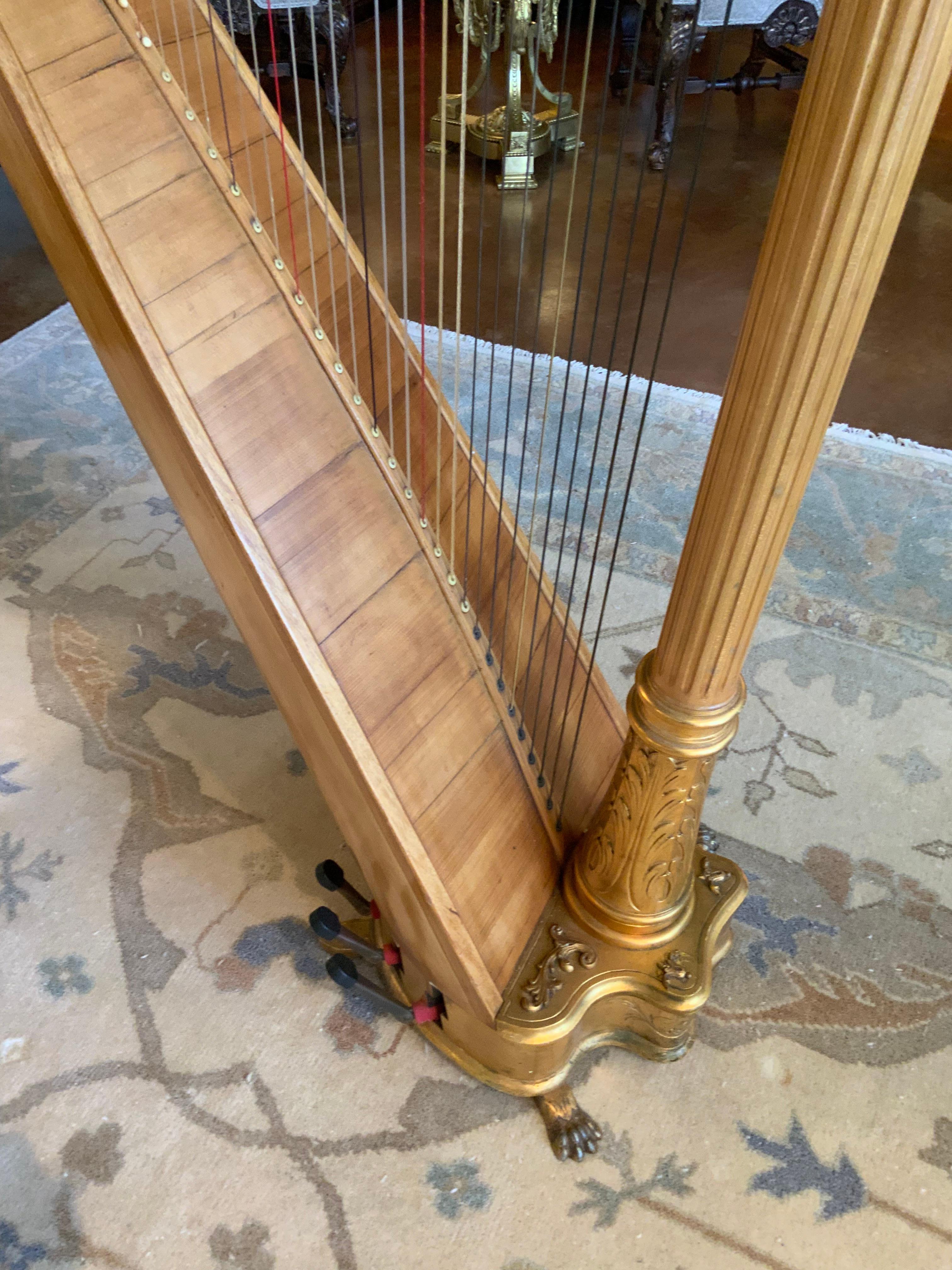 Giltwood Antique parcel gilt musical harp by Lyon and Healy