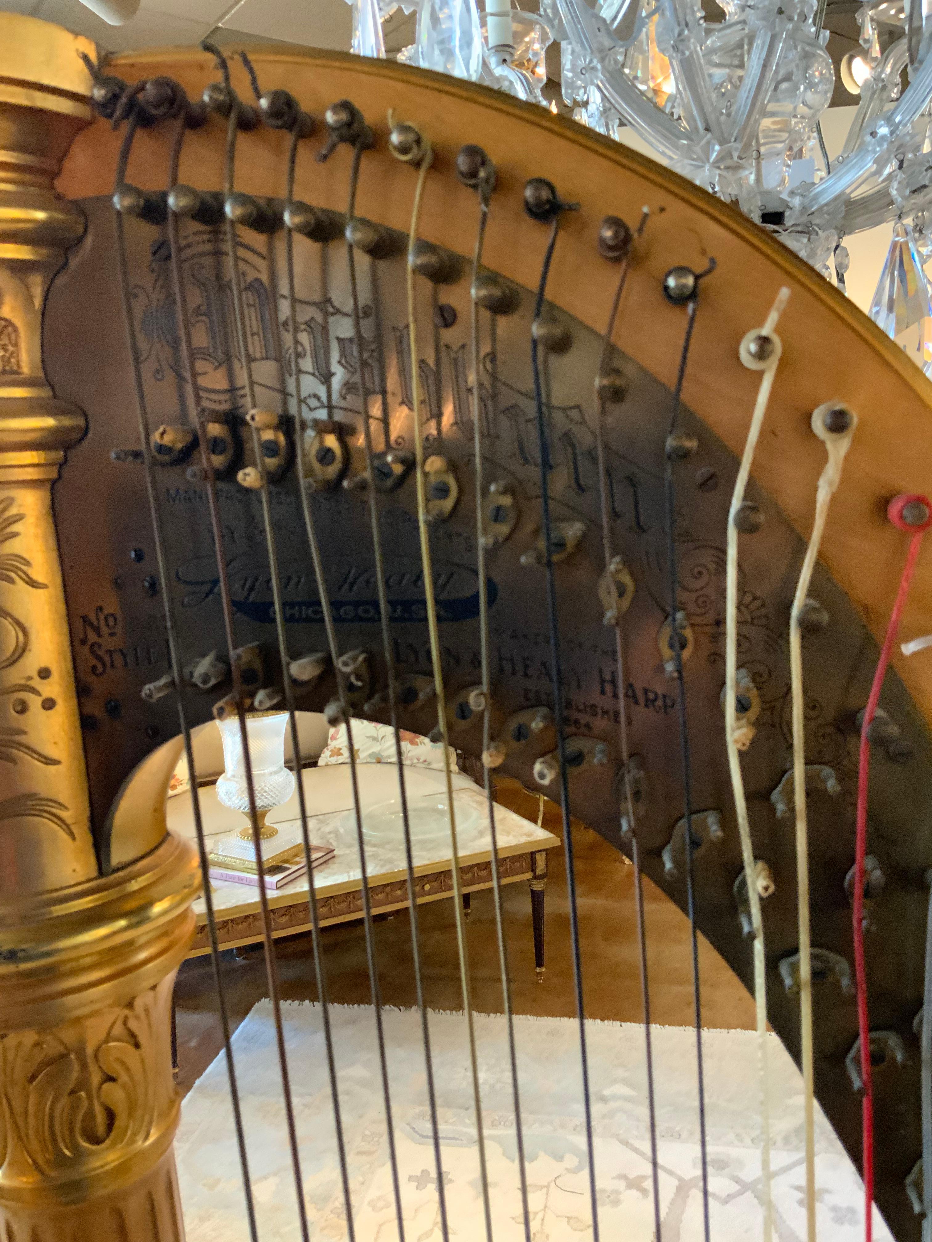 Antique parcel gilt musical harp by Lyon and Healy 2
