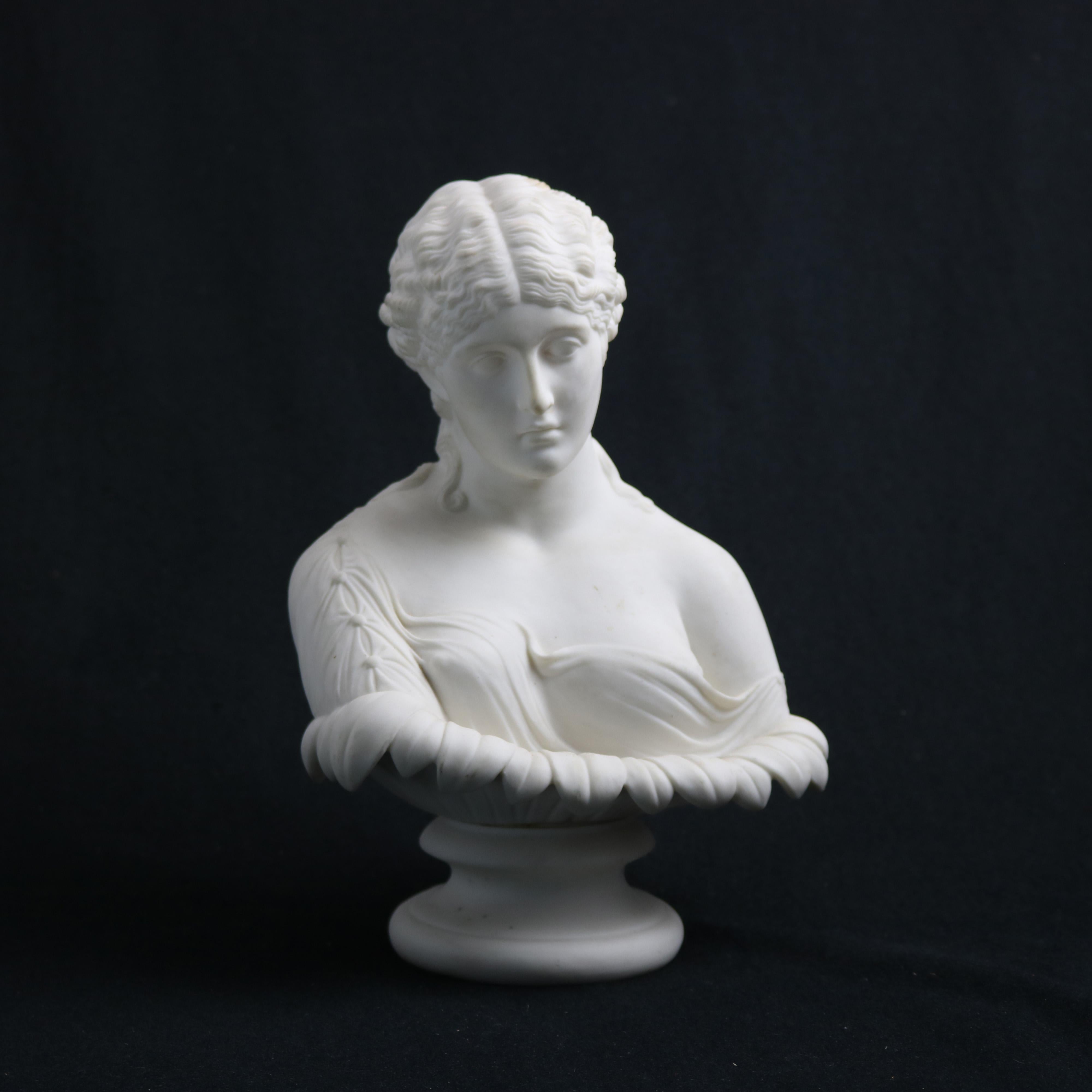 An antique Parian porcelain portrait sculpture depicts bust of Classical woman raised on circular plinth, c1890

Measures - 10.5''H x 7.5''W x 5''D.