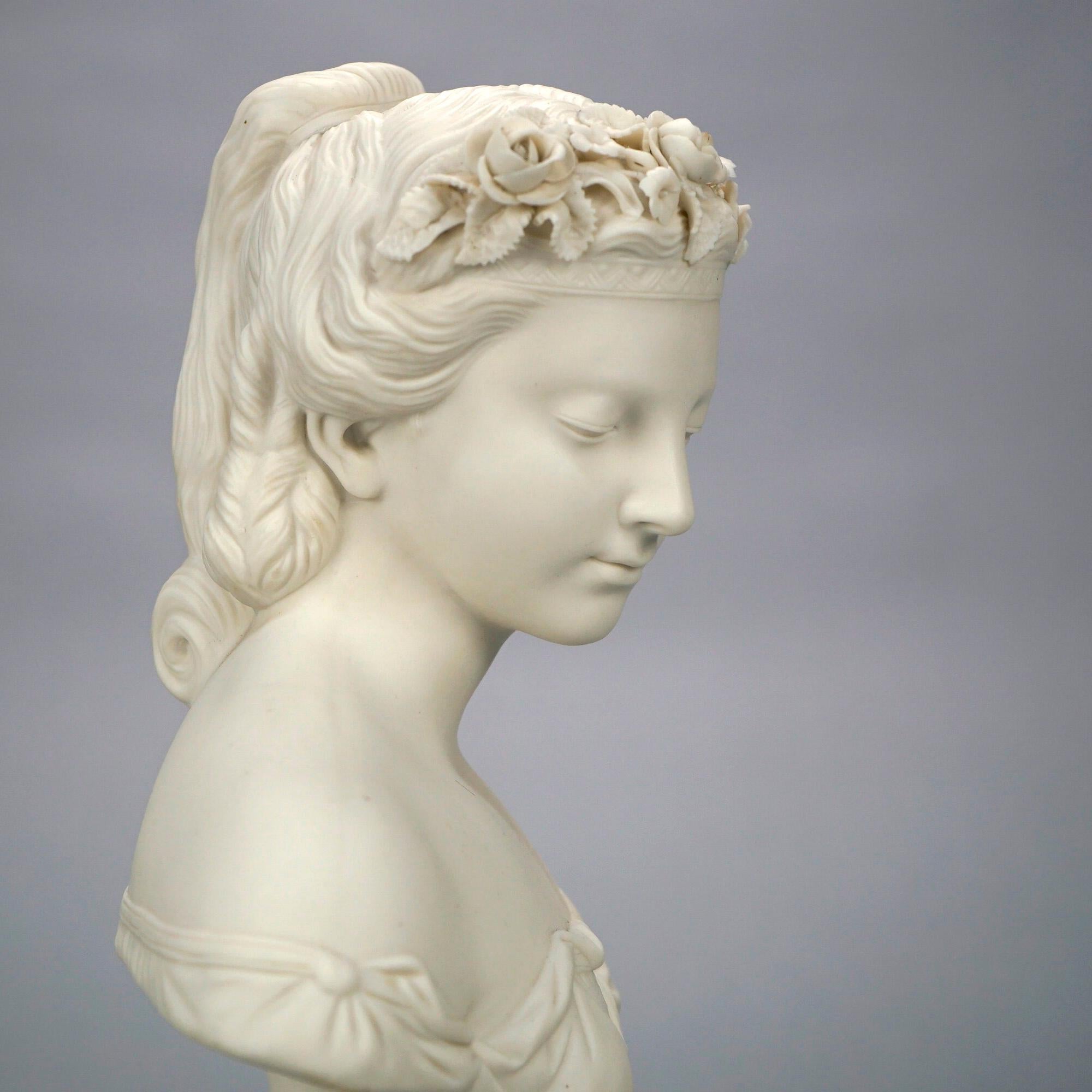 An antique parian porcelain sculpture offers bust of a Classical young woman with floral headpiece, 19th century

Measures- 11.5''H x 7''W x 4.5''D