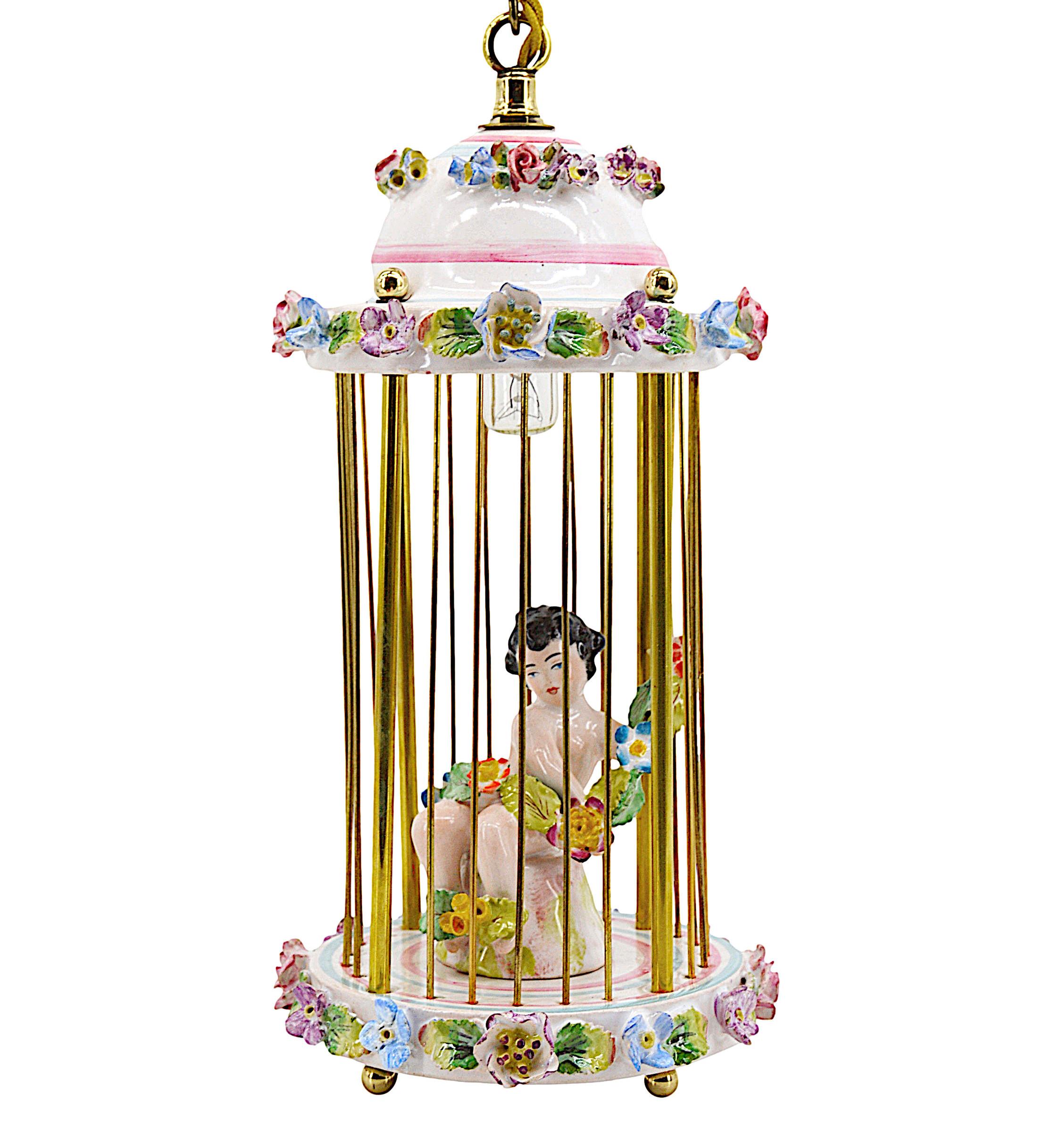 Old Paris porcelain lantern night-light, ca.1890. Paris porcelain lantern representing cupid with a garland of flowers. Measures: Height: 18