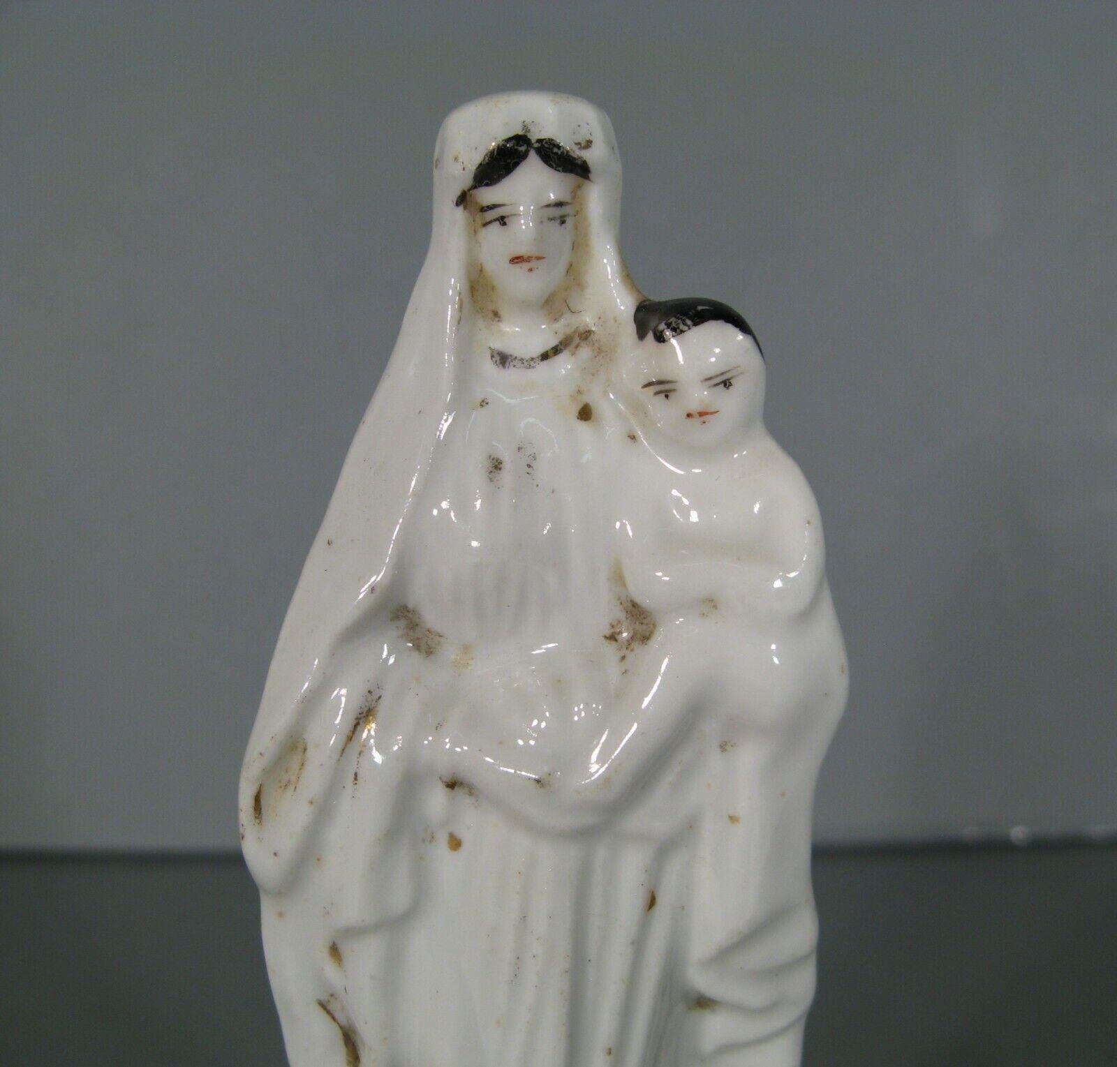 This petite antique porcelain statue depicts the Madonna and Child, crafted in Paris. Dating back to the late 19th century, this delicate piece features fine details and gilding, characteristic of Parisian porcelain of that era.

Product