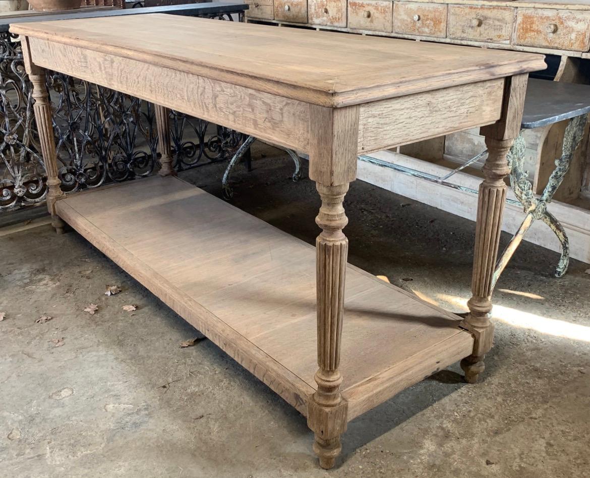 A nice early 20th century Parisian washed oak drapers table. circa 1900. This would make a great kitchen island or console table.