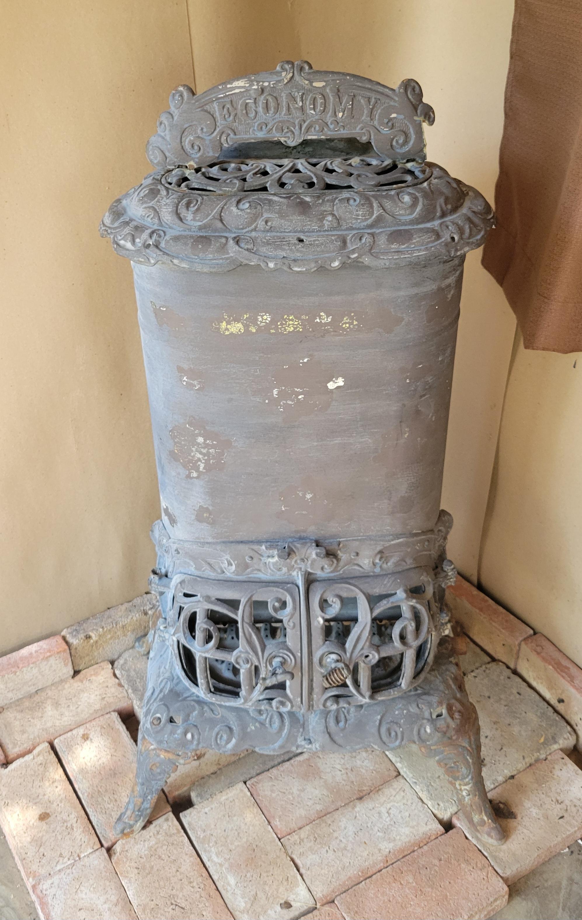 Antique parlor gas stove-heater made by the Economy Stove & Mfg Co., Micigan. The stove is about 39
