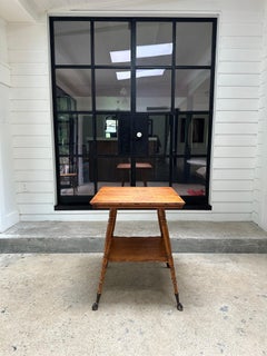 Antique parlor side table with glass and claw feet