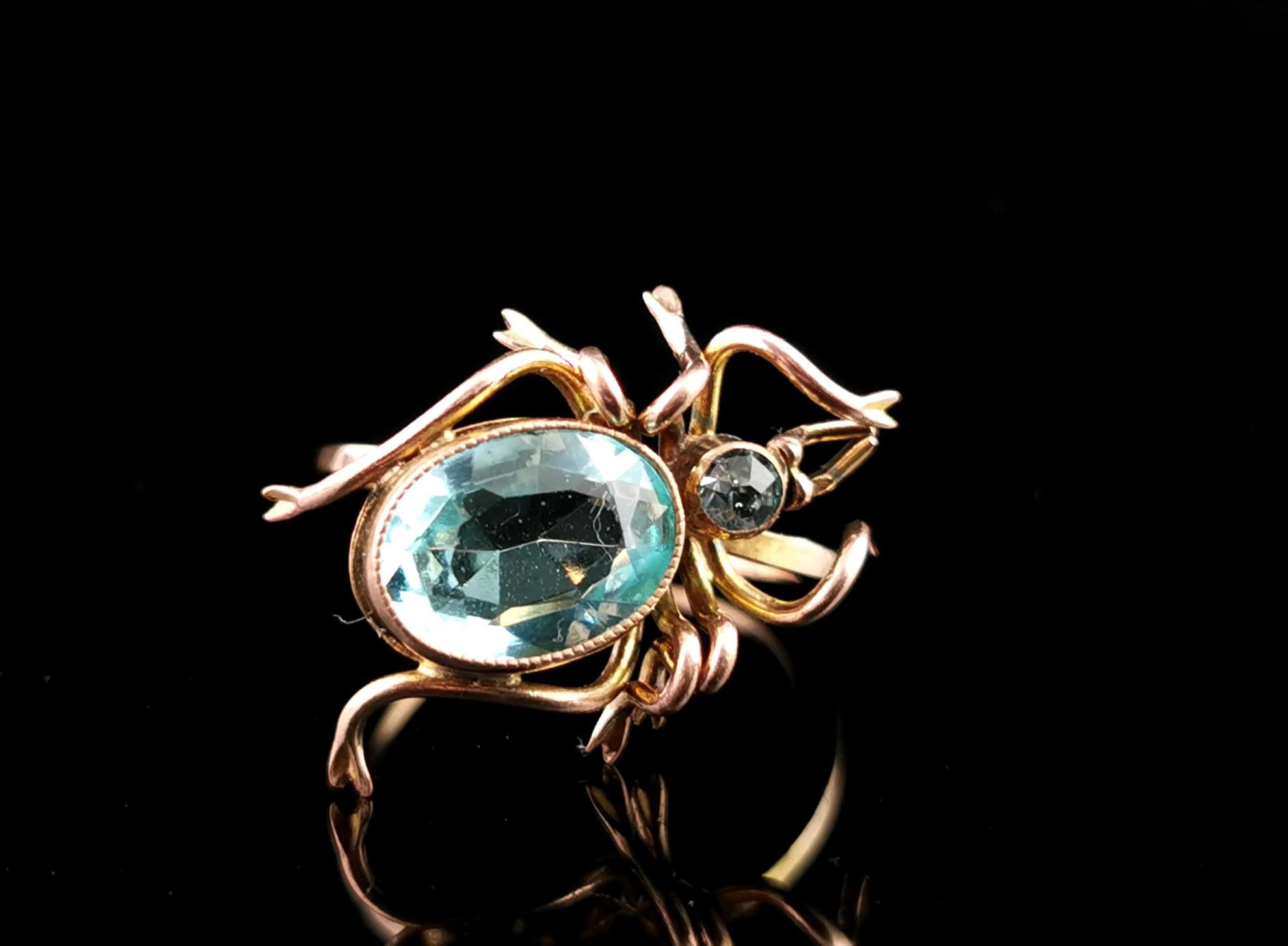 A fantastic antique paste spider conversion ring.

A 15ct rolled gold band converted from a bar brooch with a large gold plated spider to the front set with vibrant blue.

This makes for such an amazing statement ring and really stands out from the