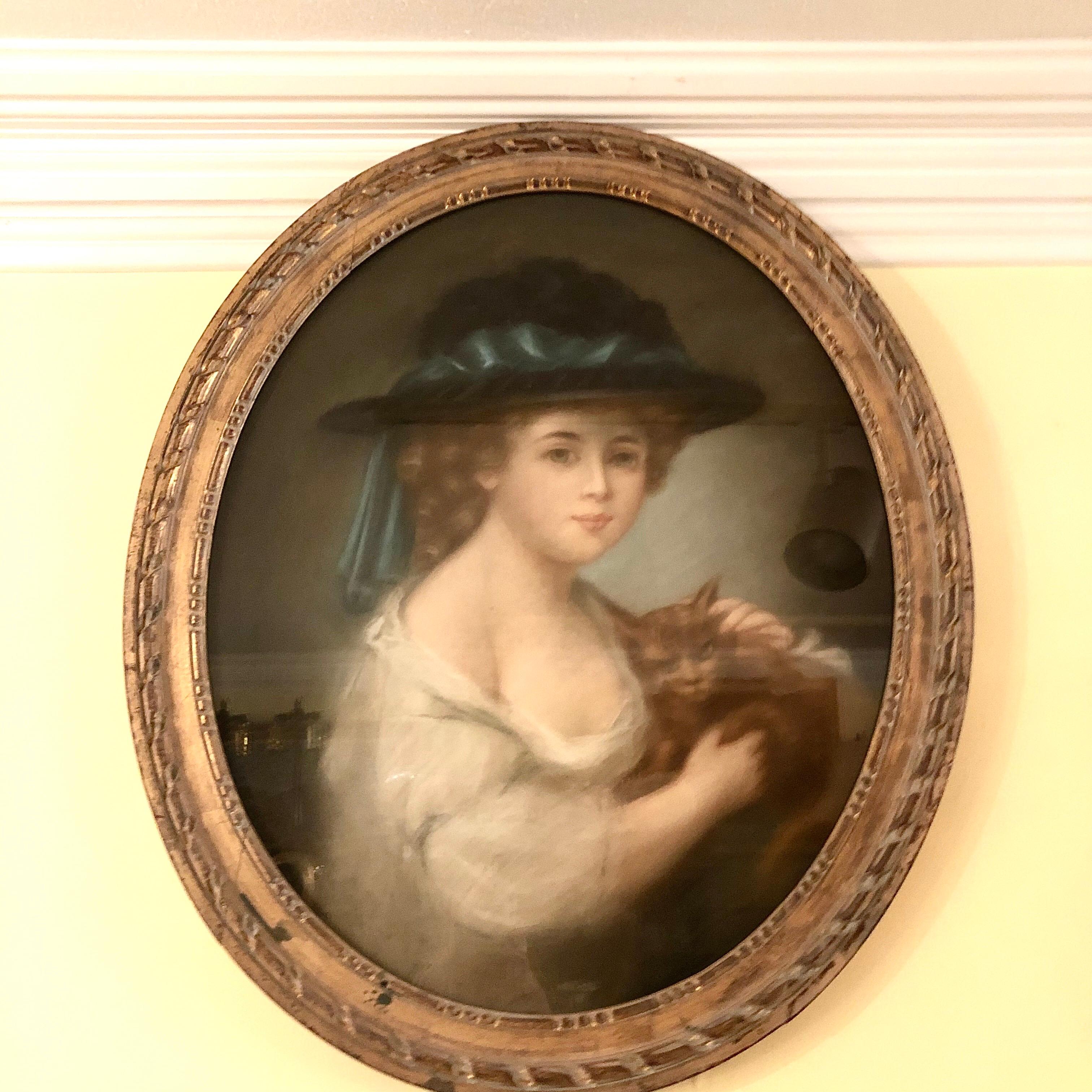 Continental school pastel painting of an enchanting young girl wearing a white hat holding her cat. This pastel painting is signed Drouet. It dates back to the late eighteenth century to the early nineteenth century. The dimensions are as follows: