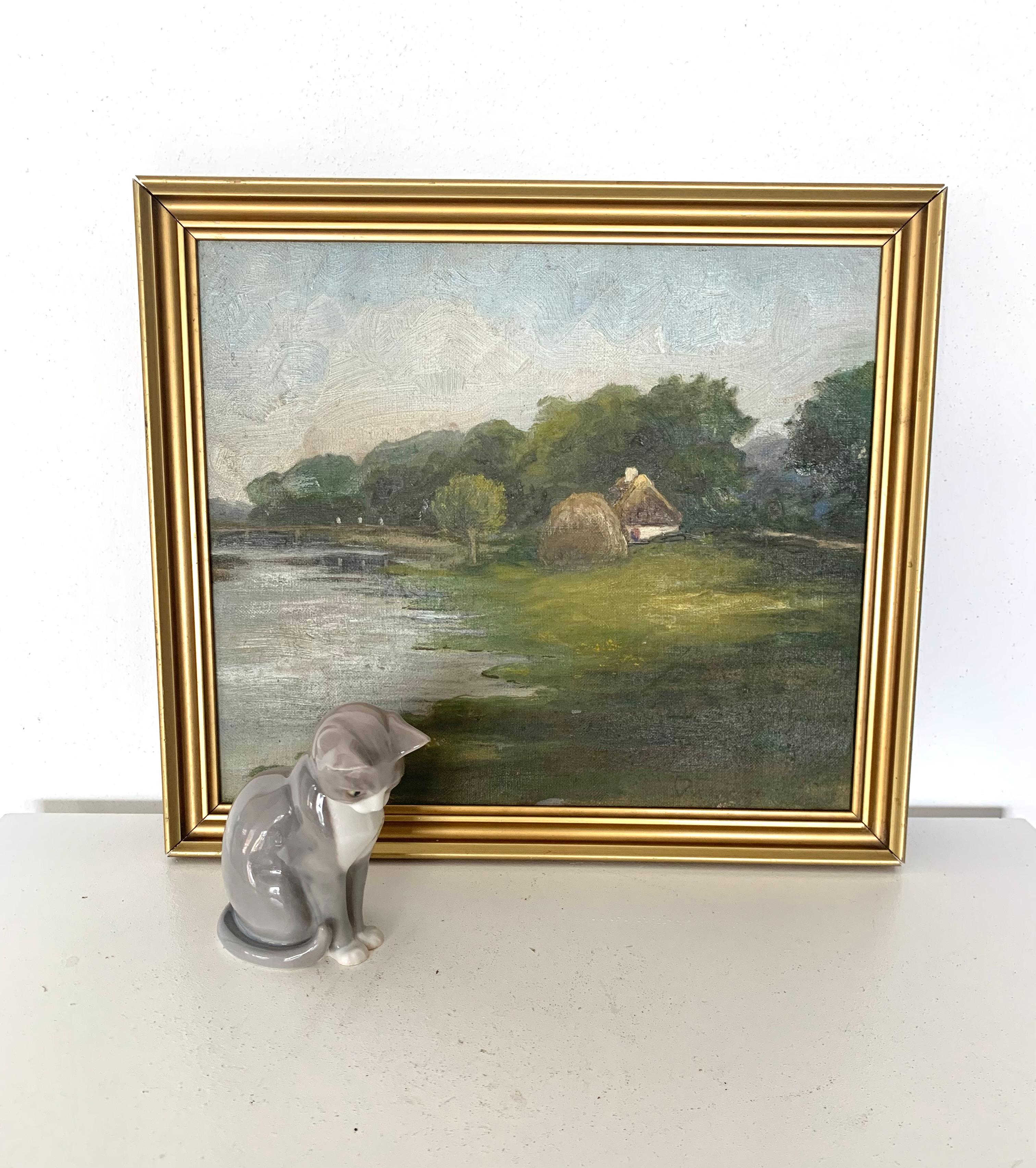 Antique pastoral oil painting of small house in a green riverside landscape For Sale 2
