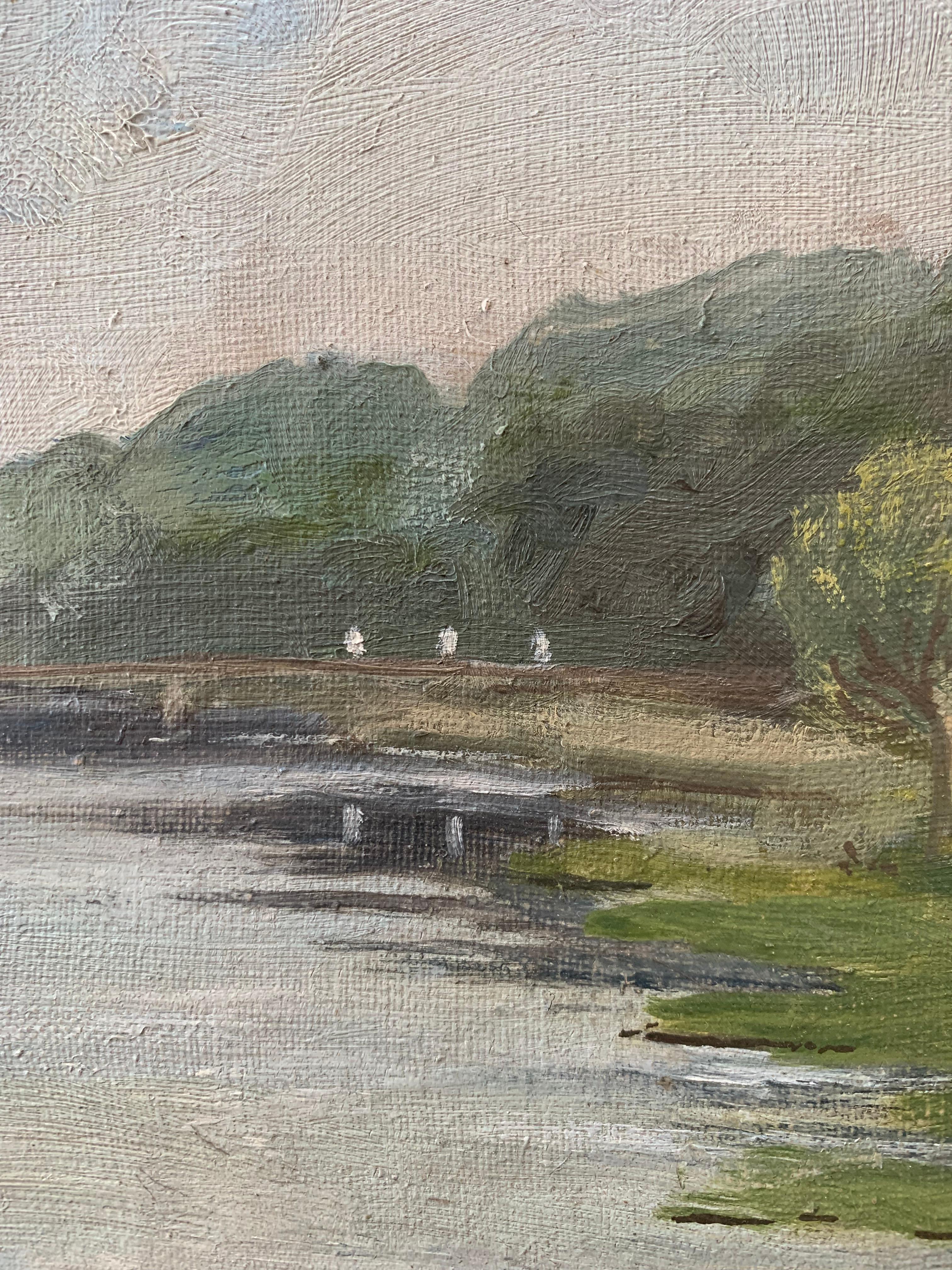 Painted Antique pastoral oil painting of small house in a green riverside landscape For Sale