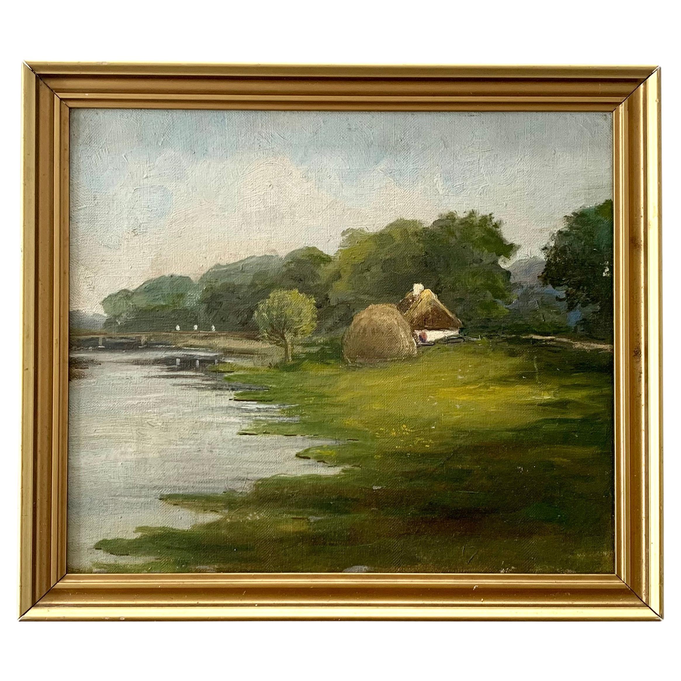 Antique pastoral oil painting of small house in a green riverside landscape For Sale