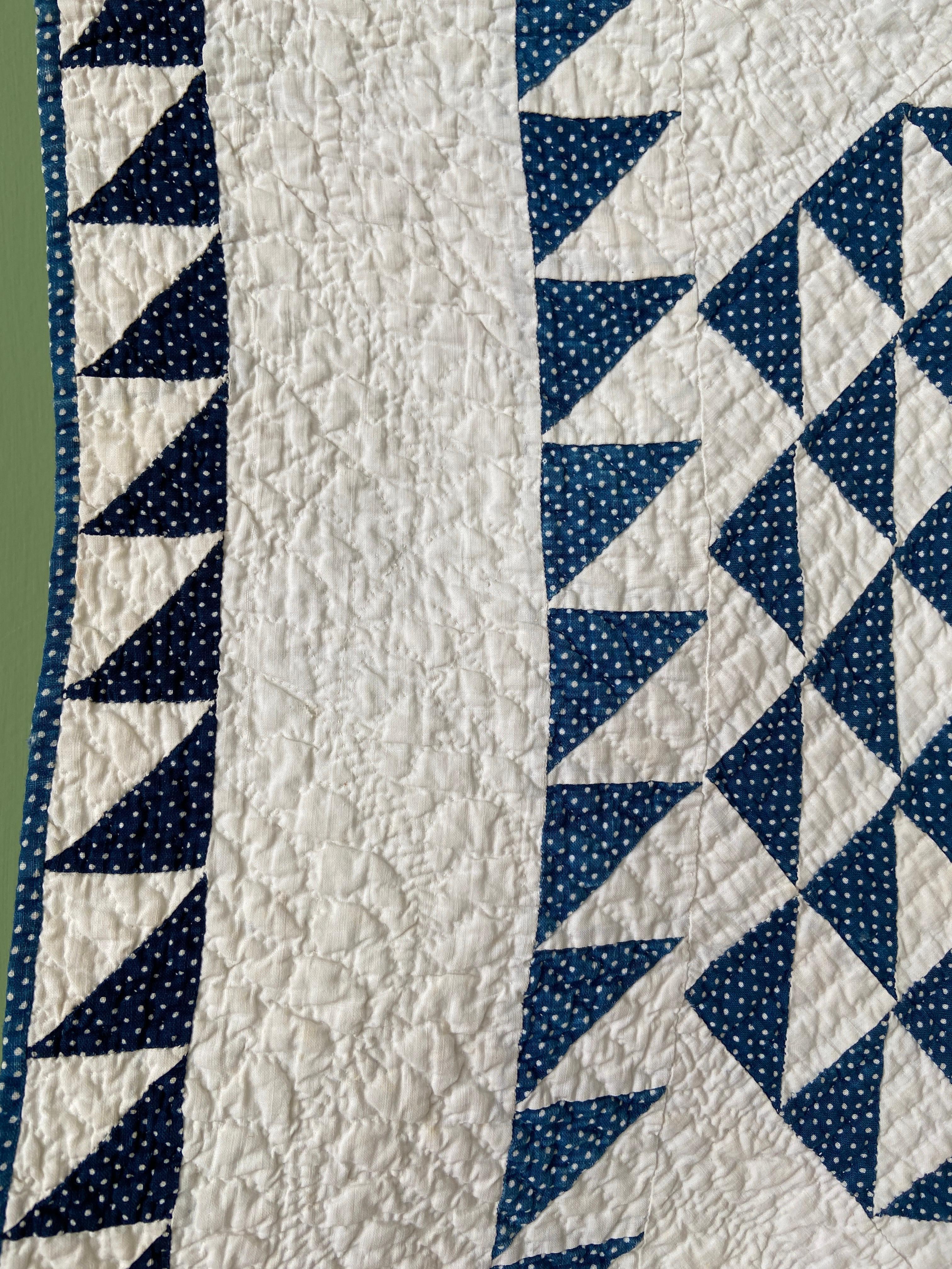 blue and white patchwork quilt