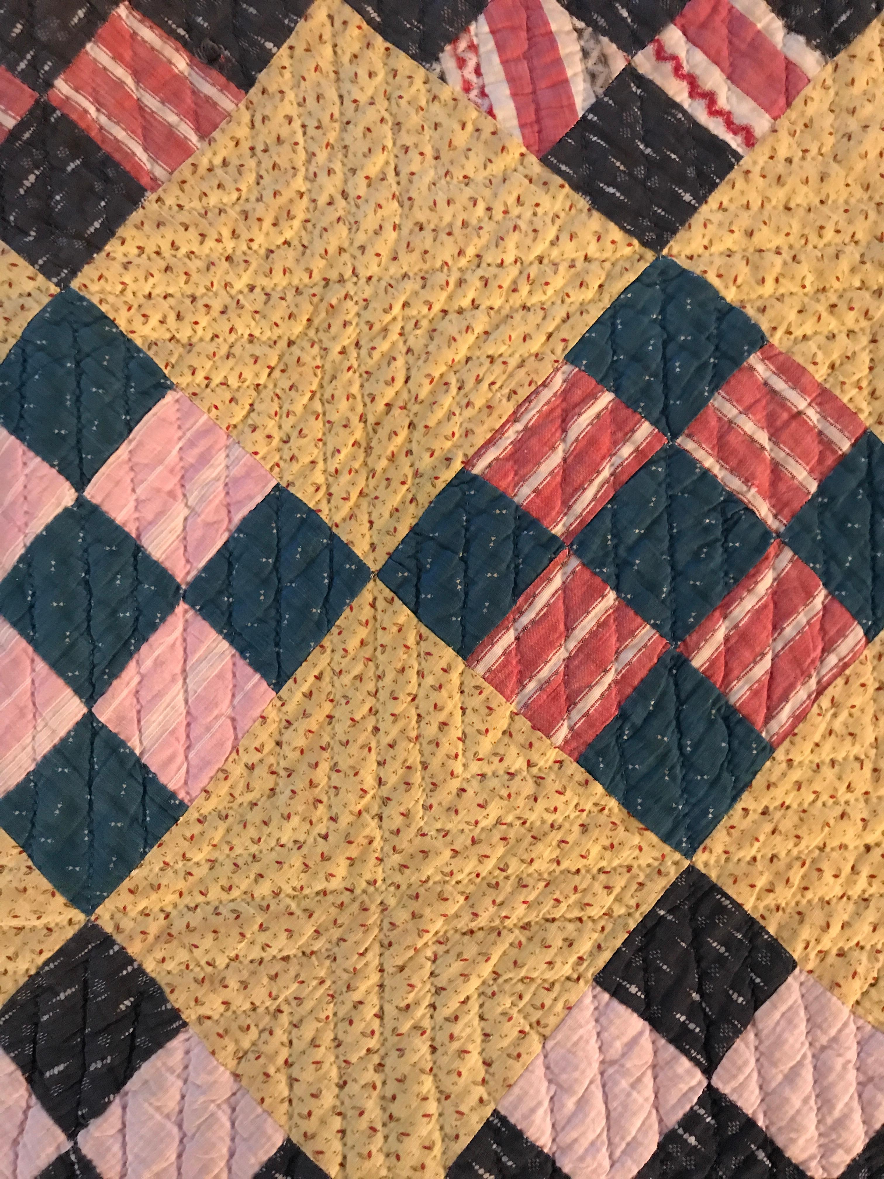 Beautiful yellow and blue antique American 'Nine Patch' patchwork quilt.