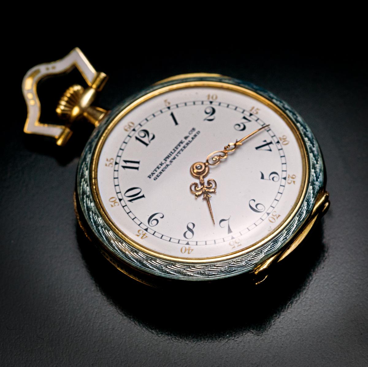 Made in Geneva, Switzerland in 1910.

This rare PATEK PHILIPPE 18K gold, platinum, diamond, gray guilloche, and opaque enamel pendant watch is in a pristine condition.

The embellishments of the watch were influenced by the Garland style of the