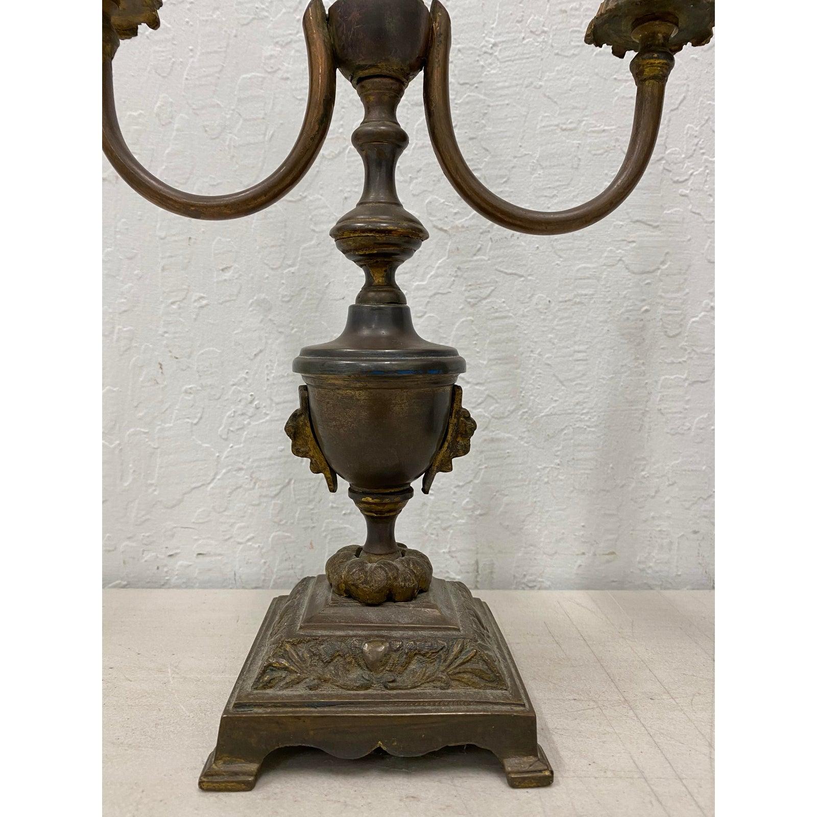 Antique patinated brass classical urn candelabras converted to table lamps

Each is wired for three lights. On / Off switch.

4.5