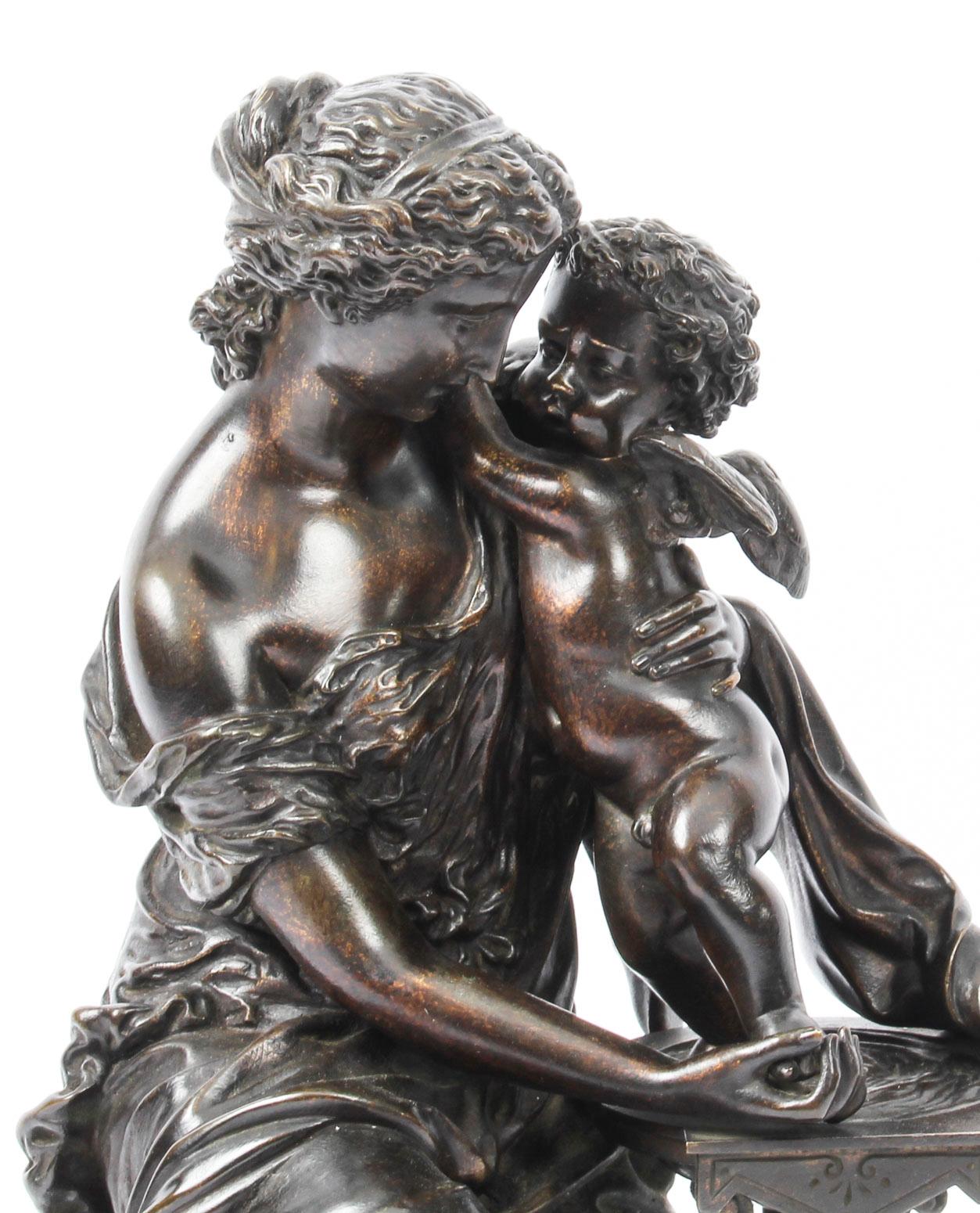 A superbly cast antique French bronze figure of a maiden and cherub by Emile Pierre Eugene Herbert (1828-1893) circa 1850 in date.
 
This dark brown patinated bronze features a seated maiden dressed in a classical flowing gown, bathing a winged