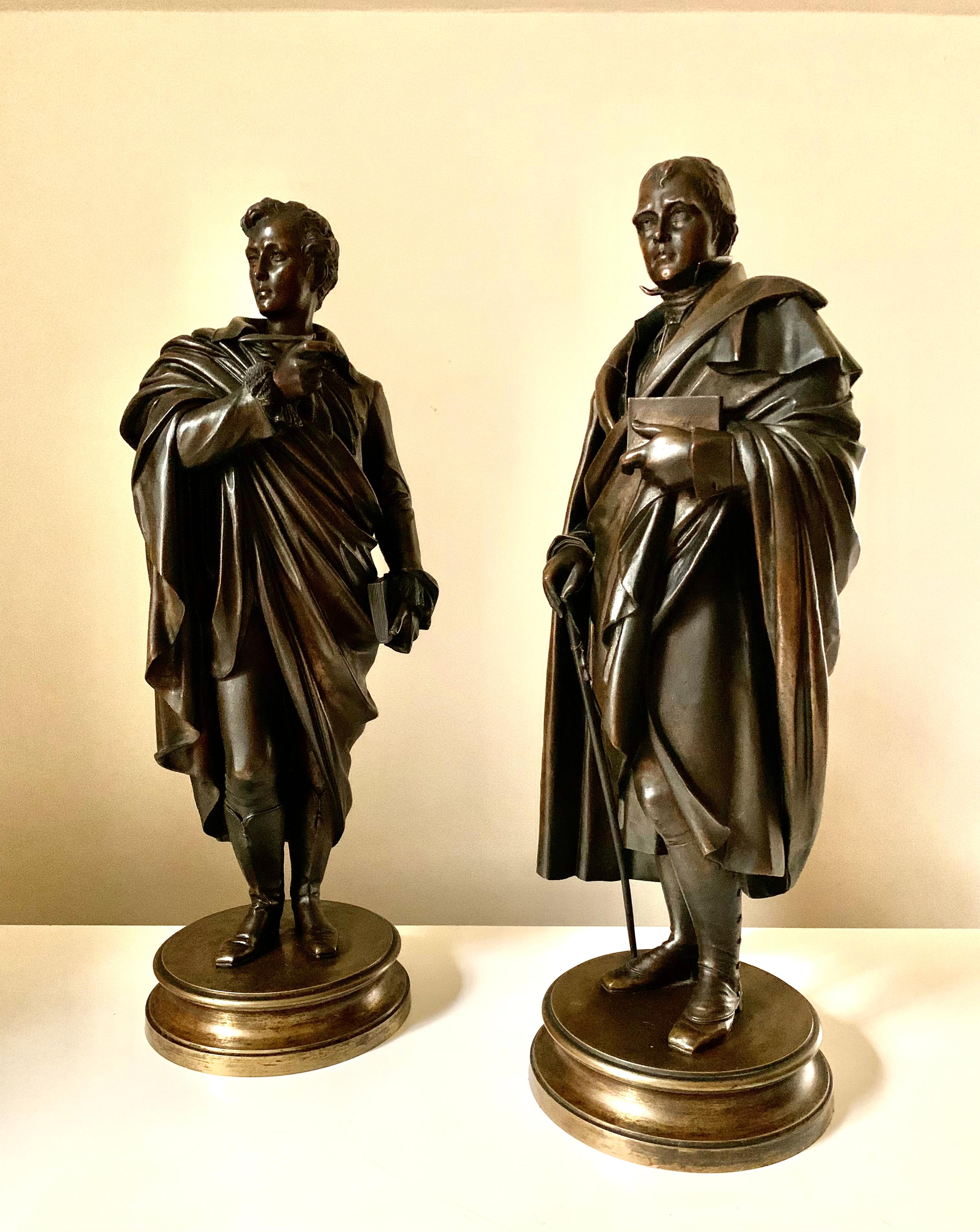 Scarce, full length patinated bronze sculptures depicting Lord Byron and Sir Walter Scott, two of the greatest literary Romantic period geniuses of the nineteenth century Great Britain.
Exceptionally detailed, Lord Byron is depicted holding a quill