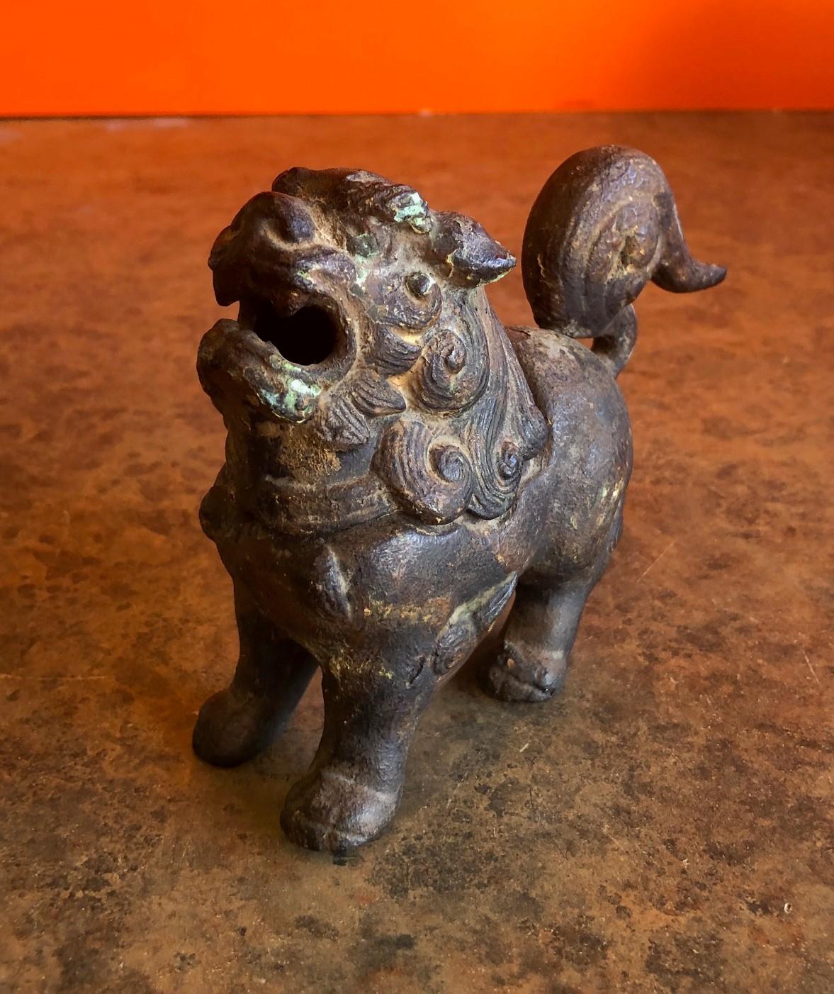Antique patinated iron foo dog incense burner, circa early 1900s. The head is removable to load with incense.