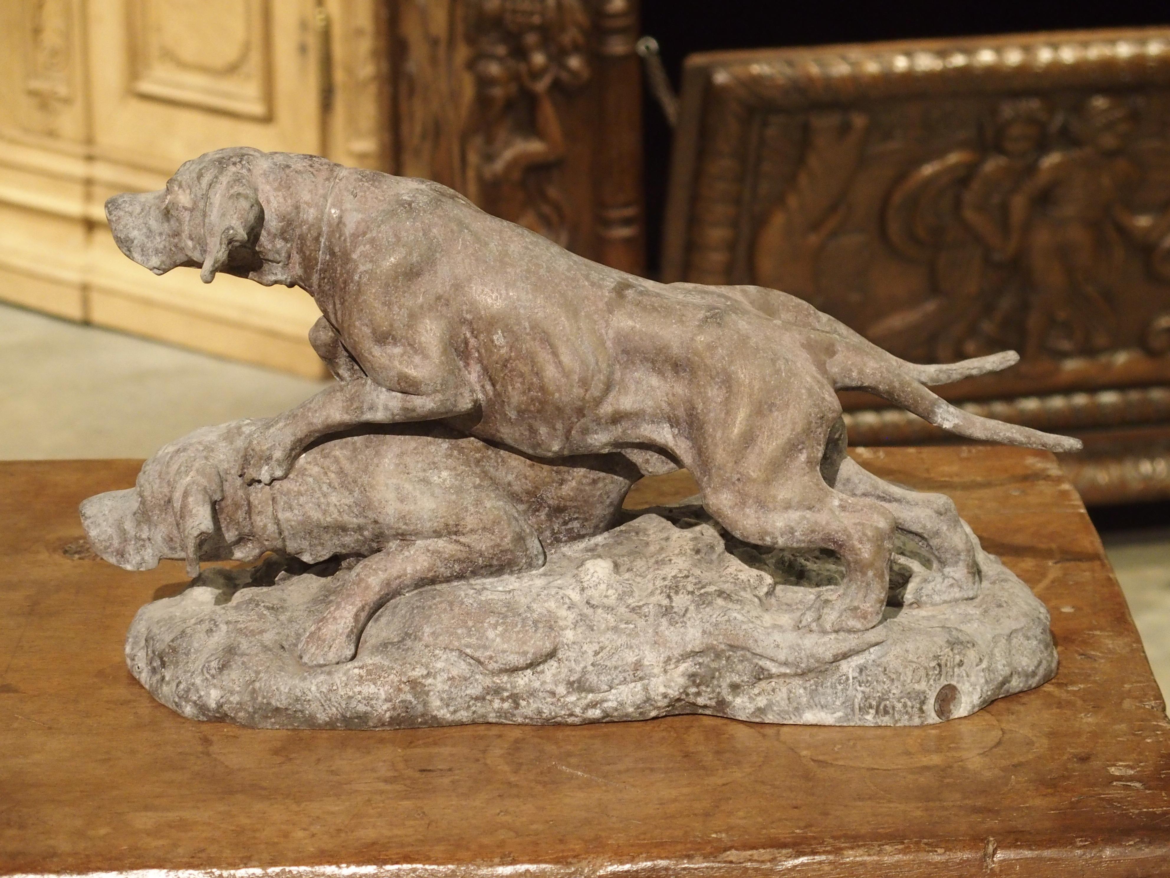 This antique sculpture of a pair of hunting dogs is made of patinated spelter and is from early 20th century, France.

Spelter is an alloy made of zinc and either copper or lead. Spelter is easier to cast than other metals and can be more