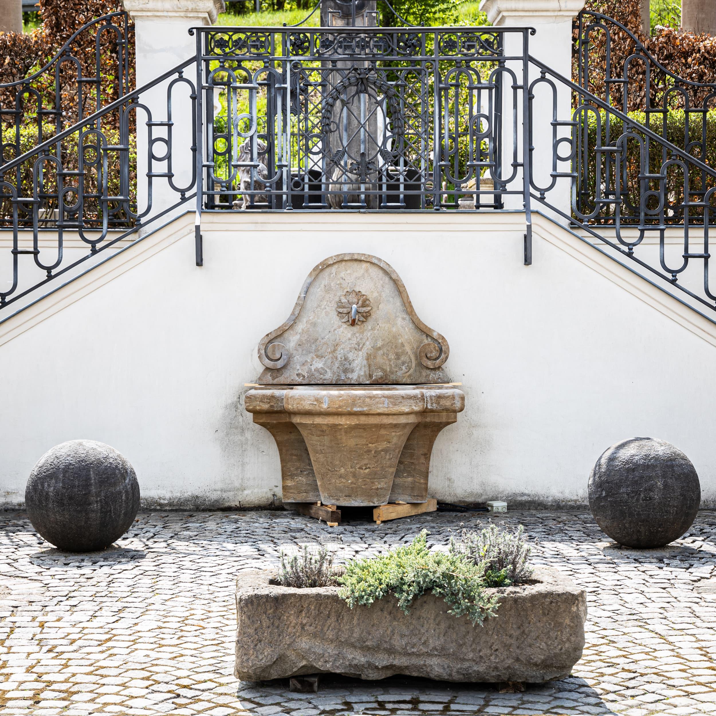 Hand-Carved Antique-patinated Wall fountain, 21st Century For Sale
