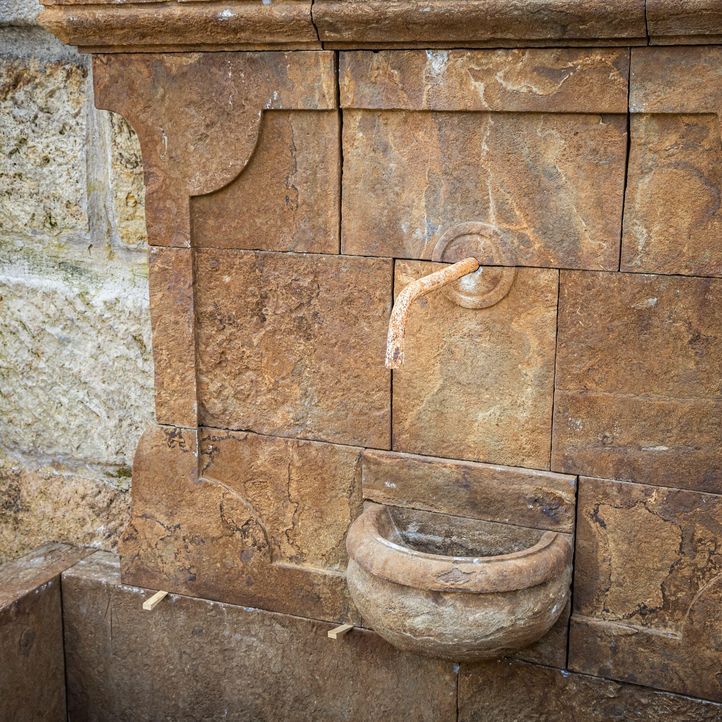Stone Antique-patinated Wall fountain, 21st Century For Sale